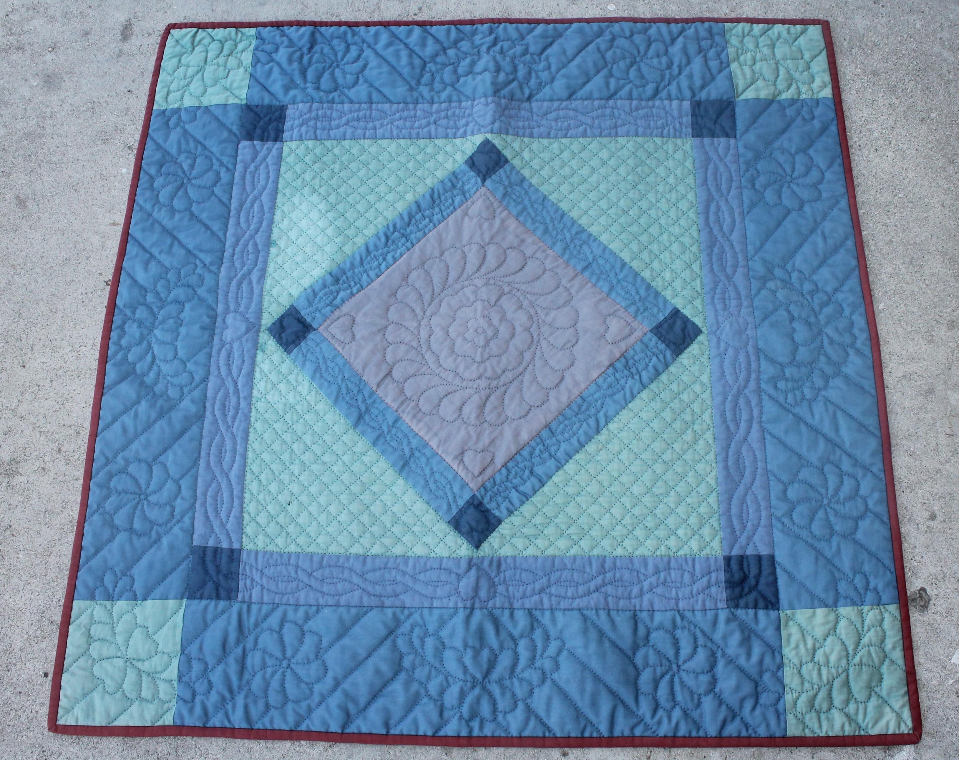 This Fine Amish Lancaster County cotton crib quilt is in Fine condition. This wonderfully pieced and quilt crib quilt has a slight fade but very sharp condition. Great Folk Art or wall art. These Lancaster County diamond in a square crib quilts are