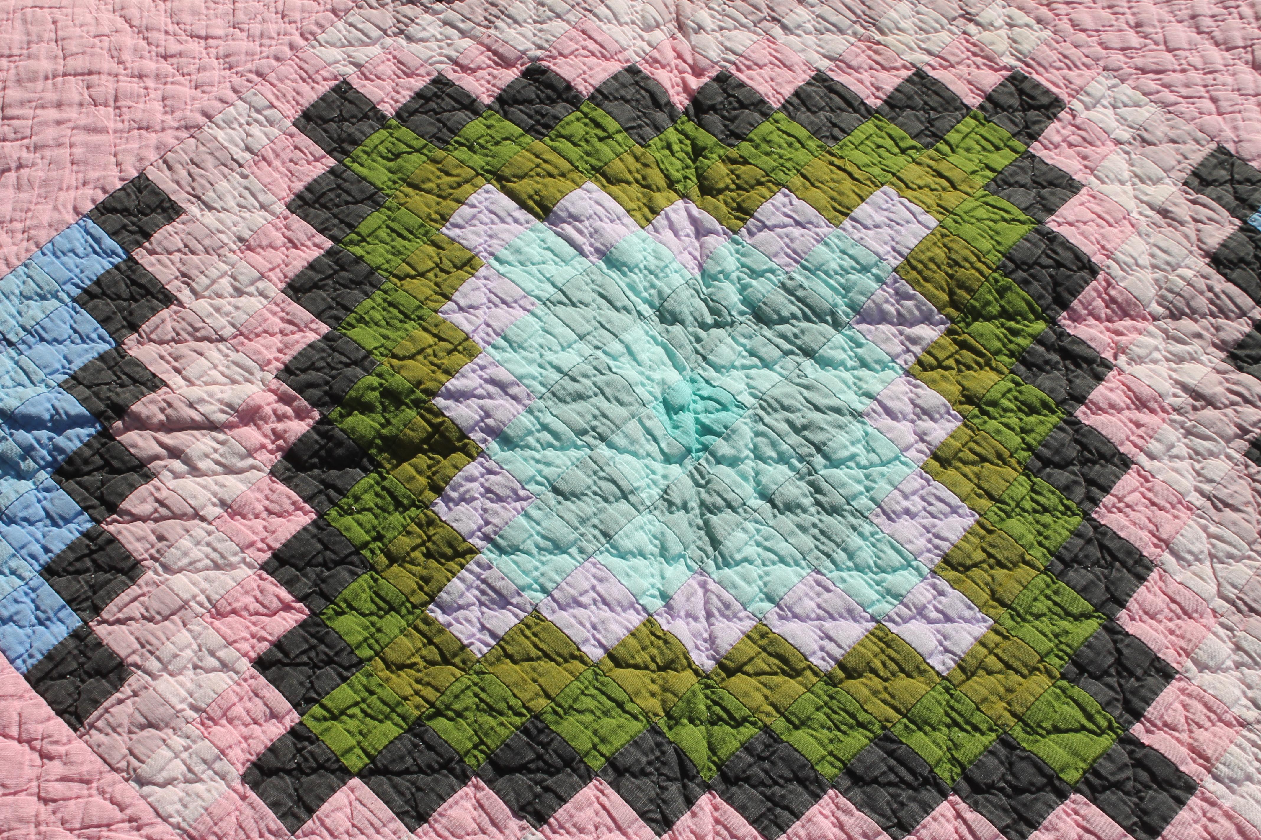 This beautiful 1930s Amish Quilt is in pristine condition. The contained diamond is in the sunshine and shadow design and color. Great color and great condition. The Border is pristine. This one patch pattern in the diamond is most unusual.
