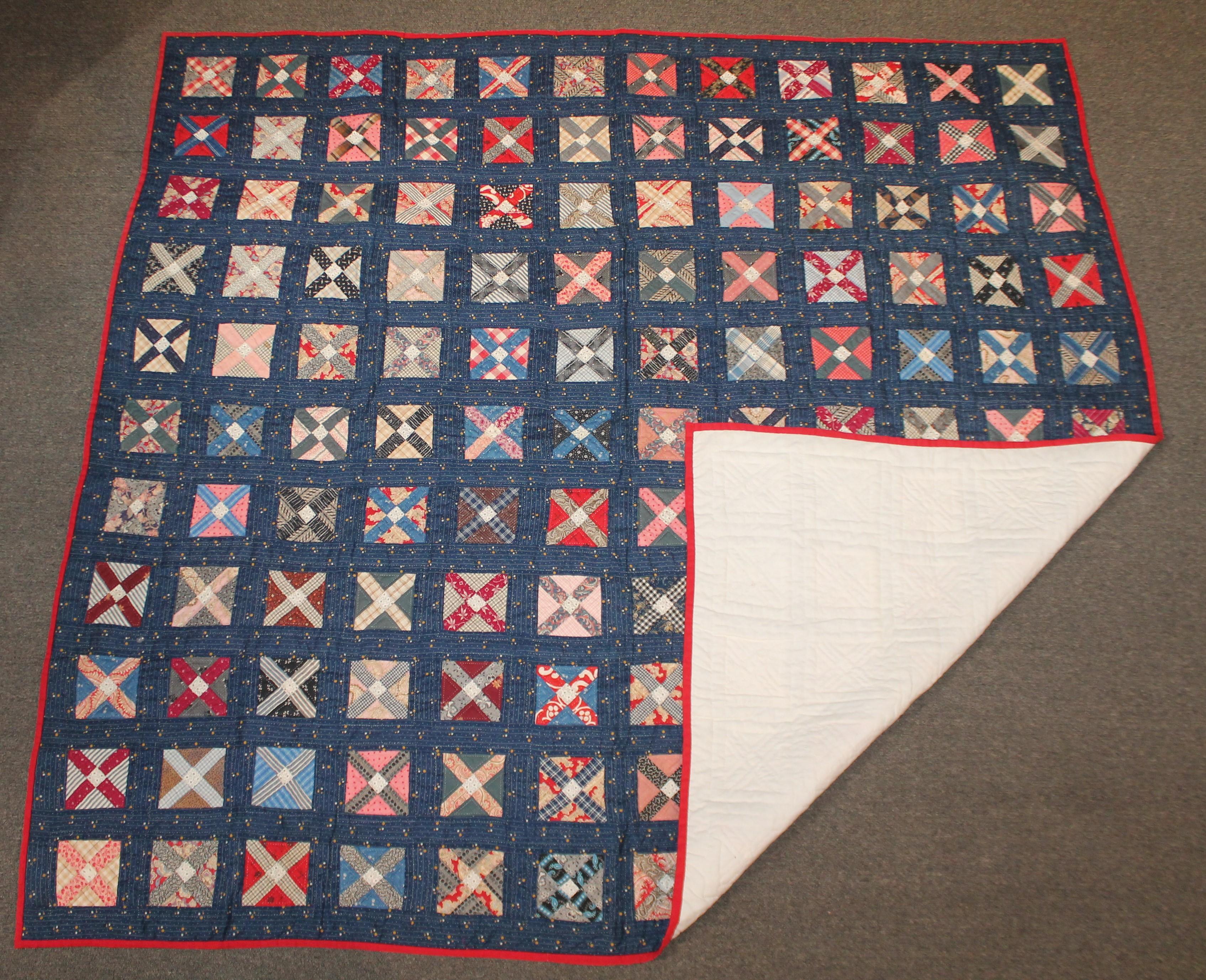 This blue calico four patch or double T's is quite unusual pattern. The condition and quilting is very good with very tight stitches. This quilt is unwashed and looks like never used.