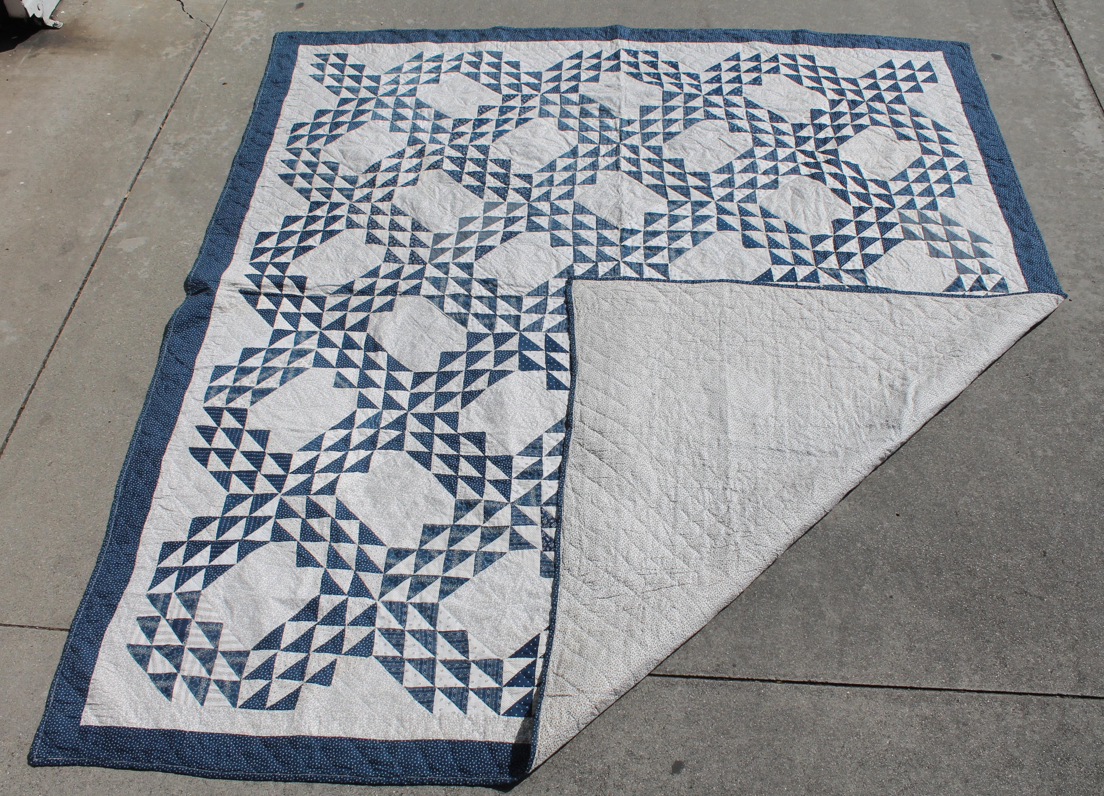 19th century blue and white ocean waves quilt in pristine condition. The white is a black and white calico print fabric. This quilt is from Pennsylvania and is a large generous size. The piecing and quilting are fantastic and it is a summer weight