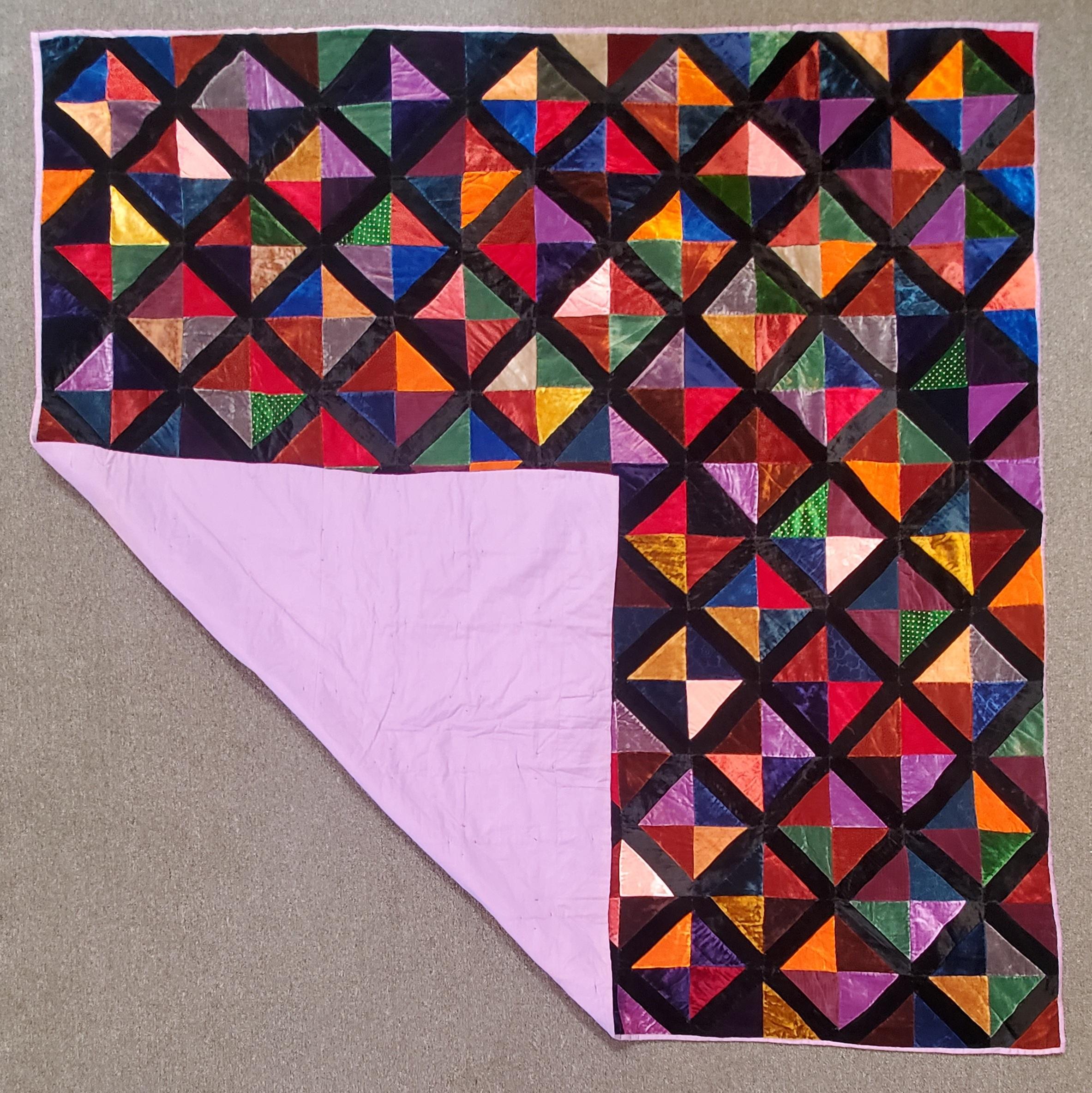 Antique velvet hour glass quilt in mint condition. This is silk velvet and has a blue cotton backing.