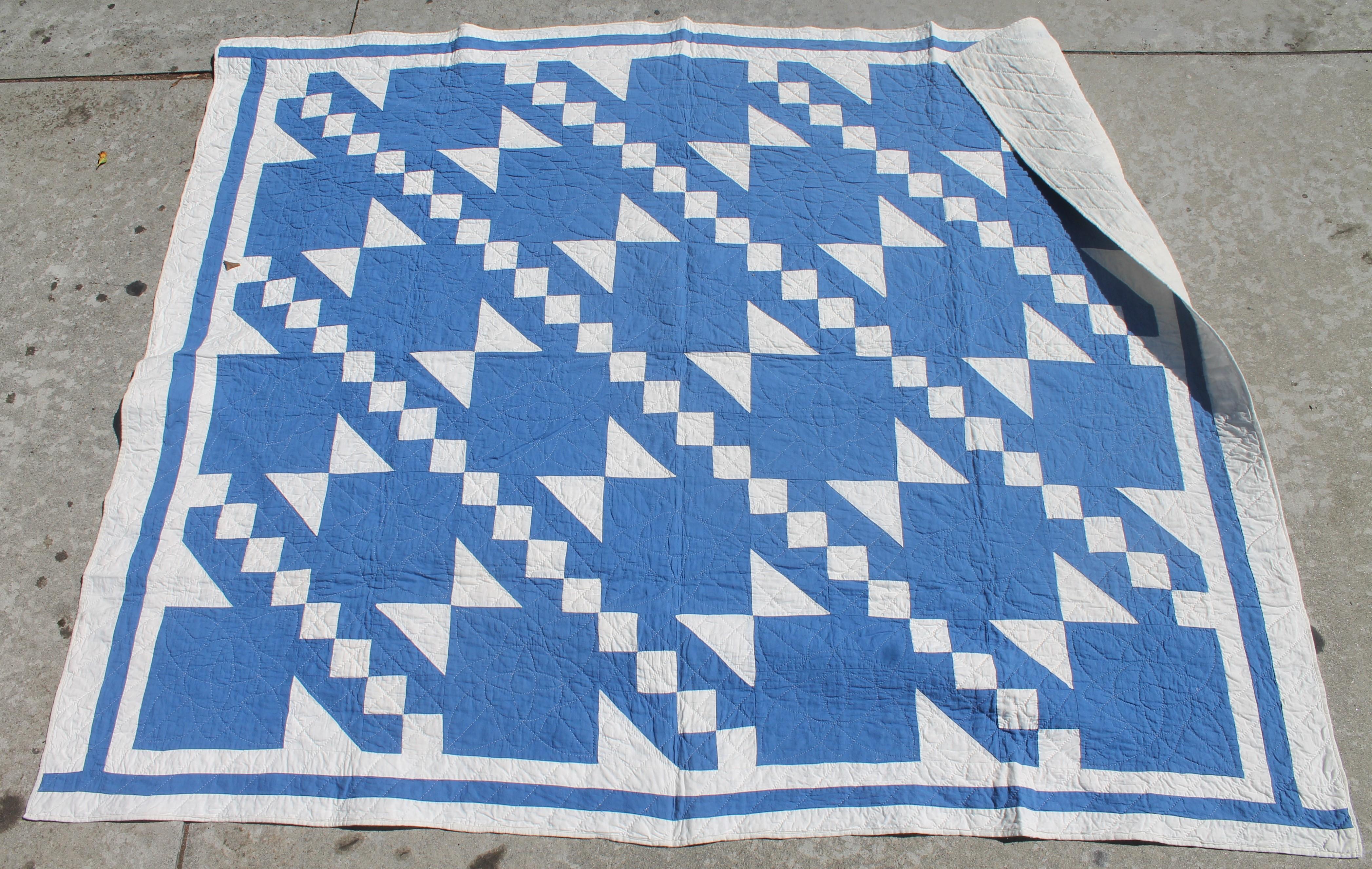 This unusual blue color is a fantastic pattern and fine quilting. The inner border frames it well. This is a smaller quilt and great for hanging.