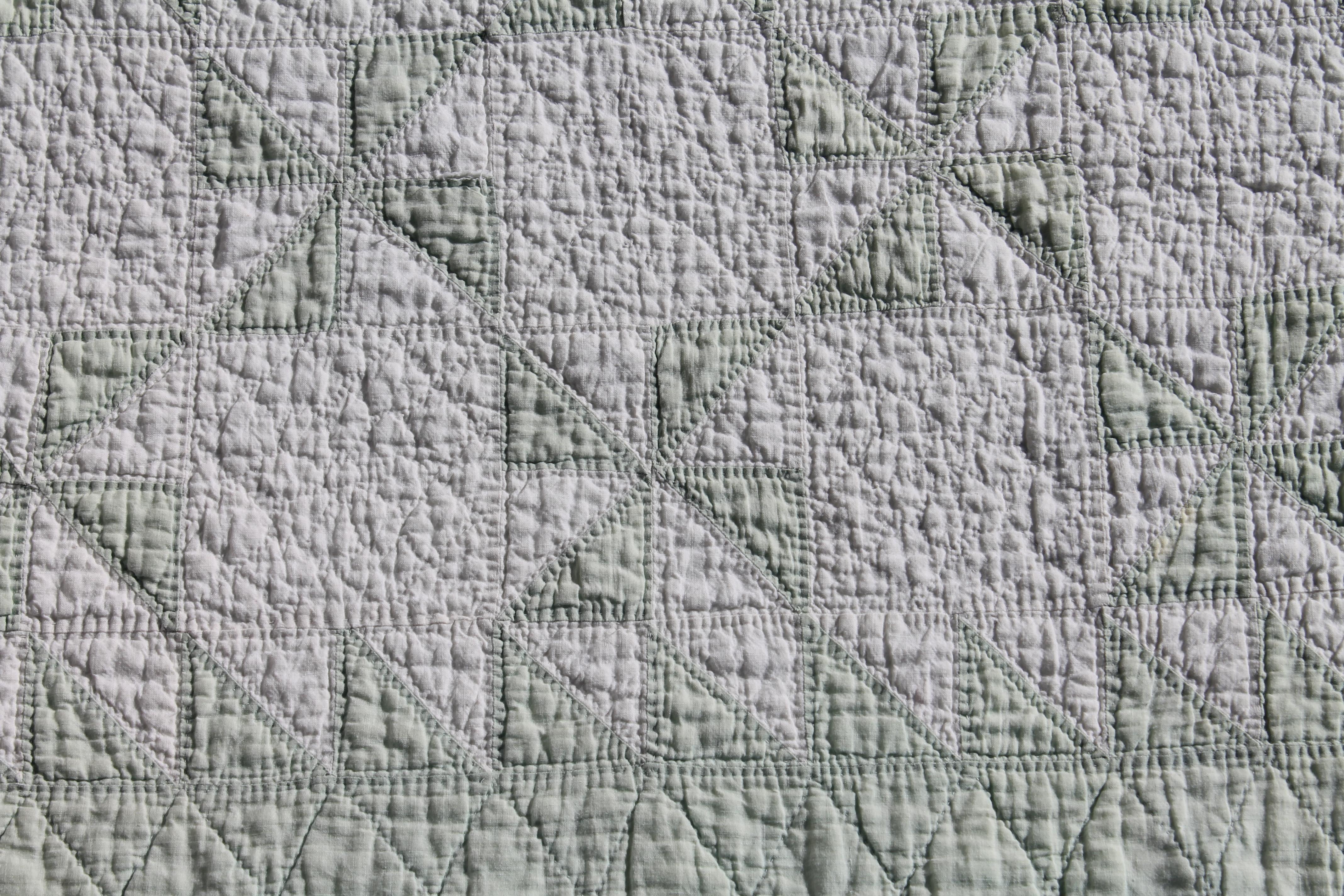 green and white quilt