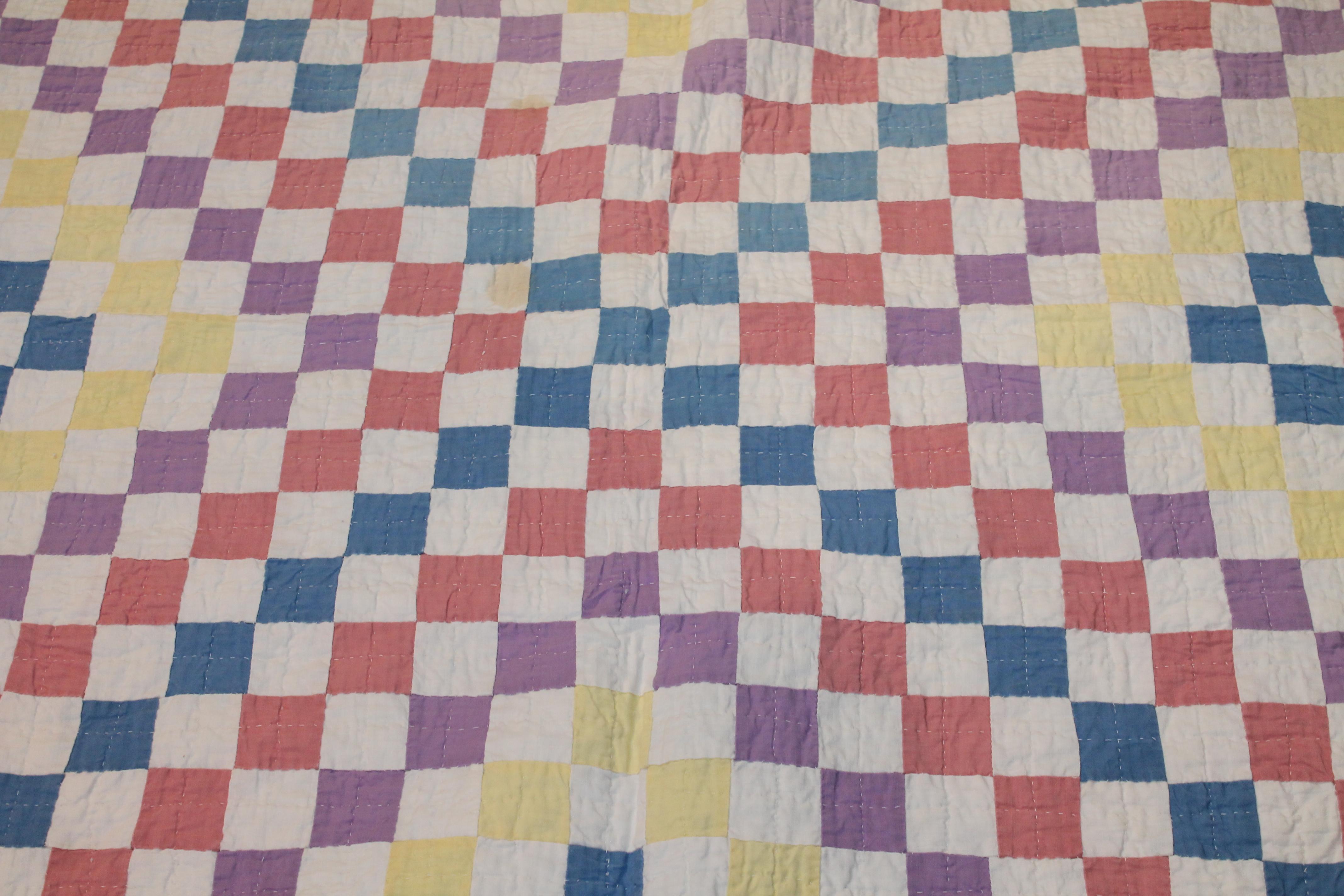This pastel postage stamp quilt is such an unusual pattern and fine barber pole sliding border. The condition is very good and minor fade on one edge or border to the right of the photo.