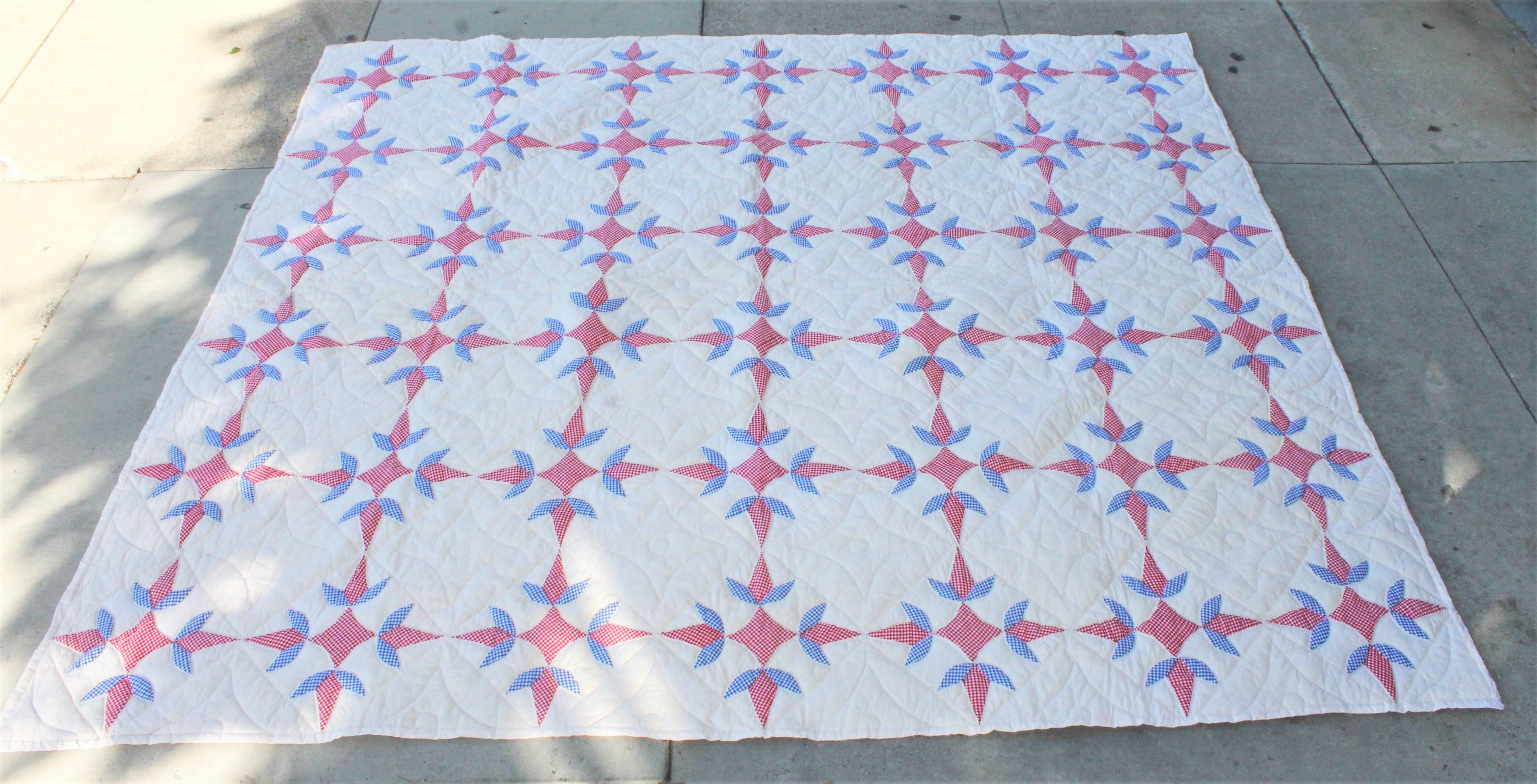 This fun red, white and blue geometric quilt is in fine condition and a very good size. Will fit a queen or king bed.