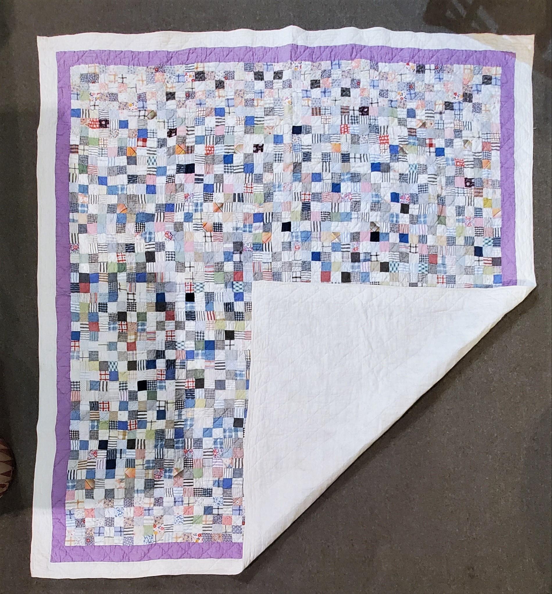 This fine quilt looks like a painting. Its multi pieces are all a collage of many different fabrics. The condition is very good and it has been prof. laundered.