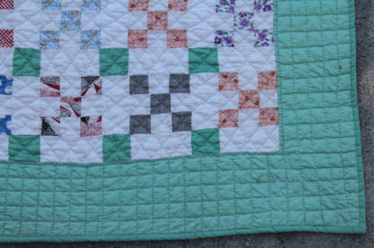 This fine tiny pieced postage stamp chain quilt is in pristine condition. This quilt is from the 1930s and made from old calico dress prints.