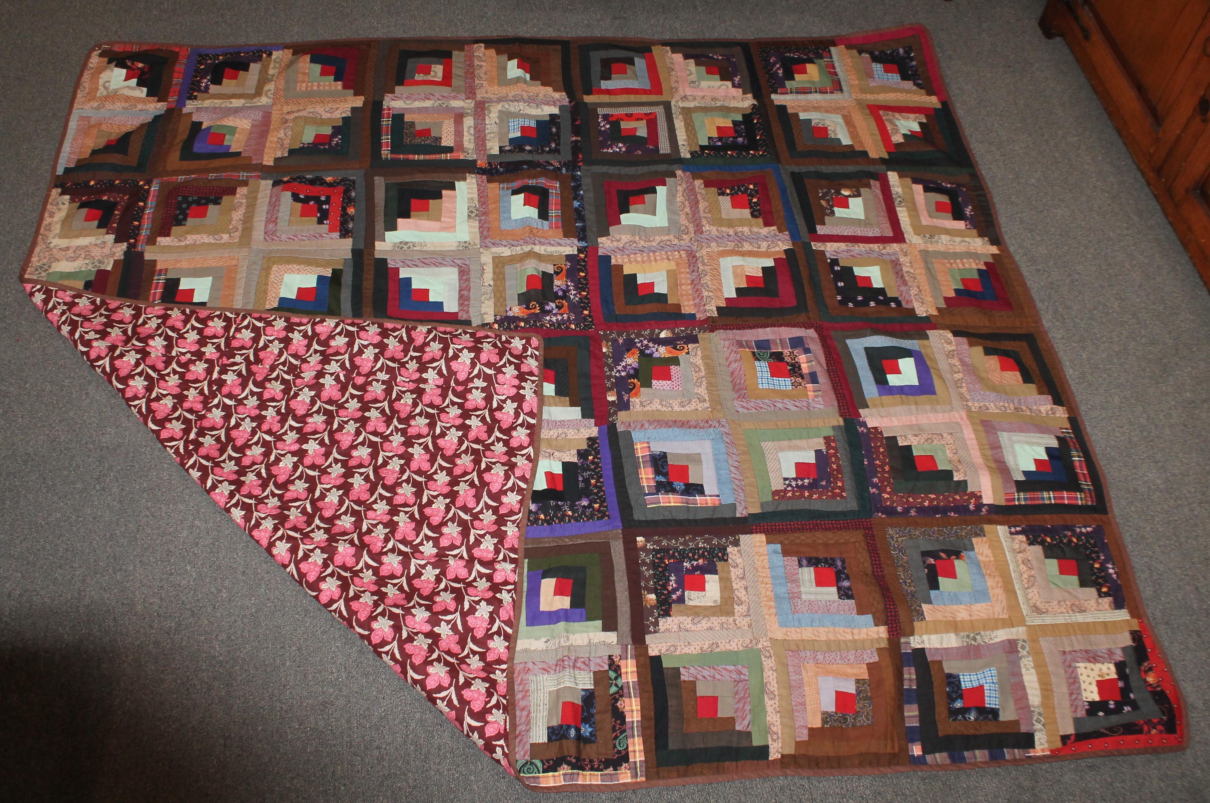 This 19th century wool challis log cabin / barn raising pattern quilt is in fine condition. Very nice piece work and quilting. The condition is pristine.