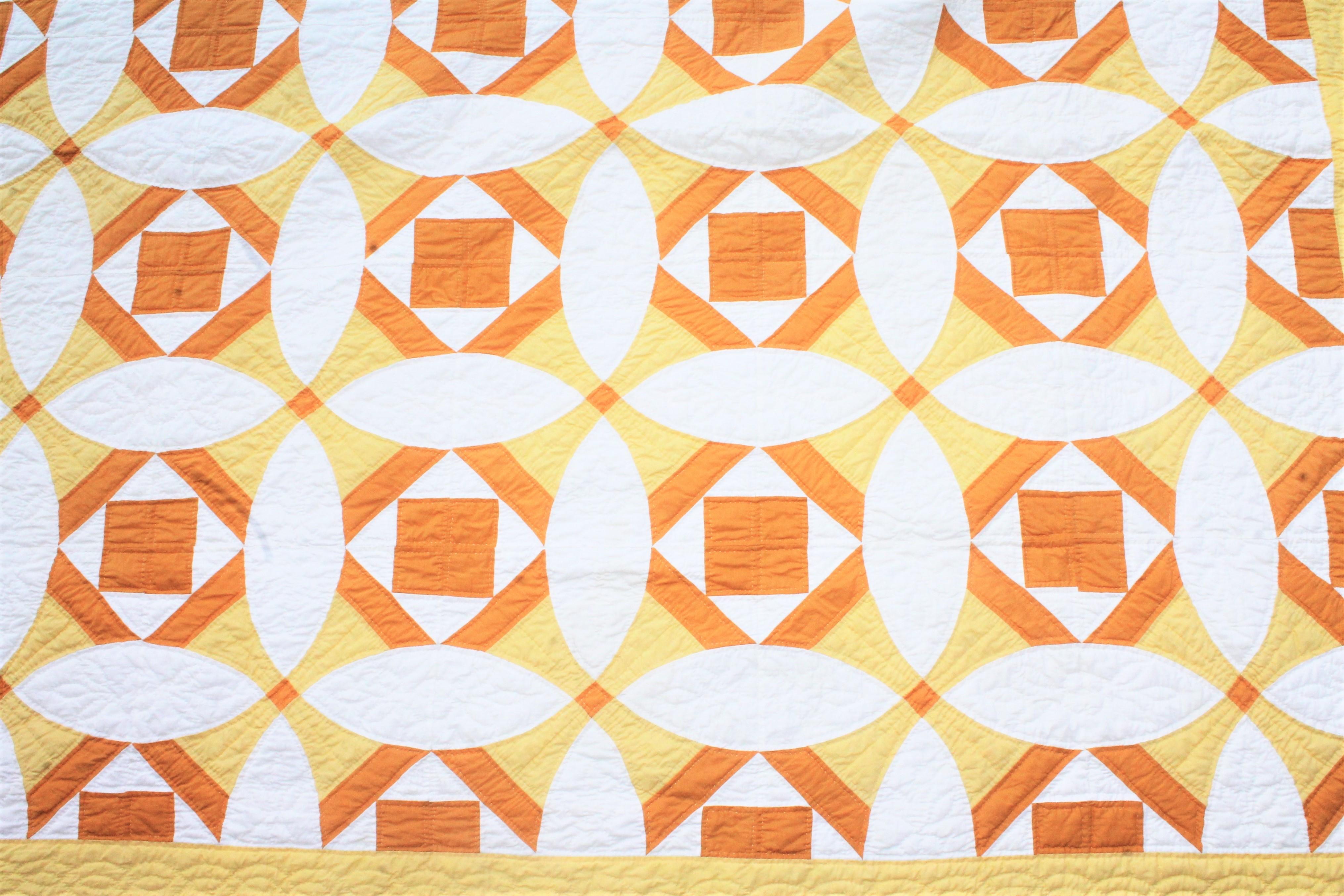 This finely pieced and quilted yellow and white quilt is in fine condition. There is also shades or rust in areas as well. Very nice quilting.