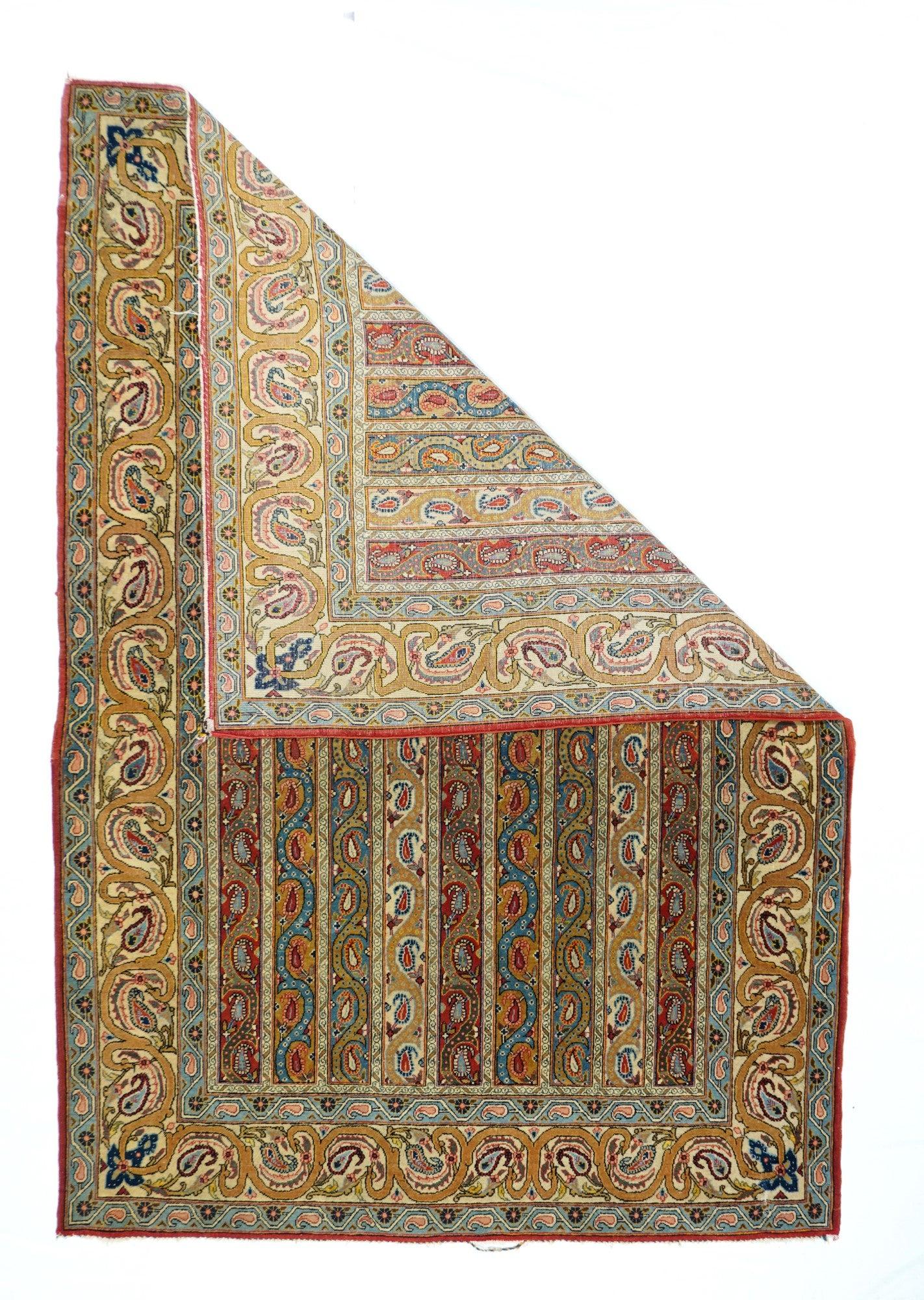 Antique Qum rug, measures: 4'8'' x 6'10''. Certainly west or SW Persian, this wool foundation, naturally colored nomadic Kellegi shows a navy field filled with angular botehs, the ecru ones forming a triple lozenge over-pattern pole medallion. Ivory