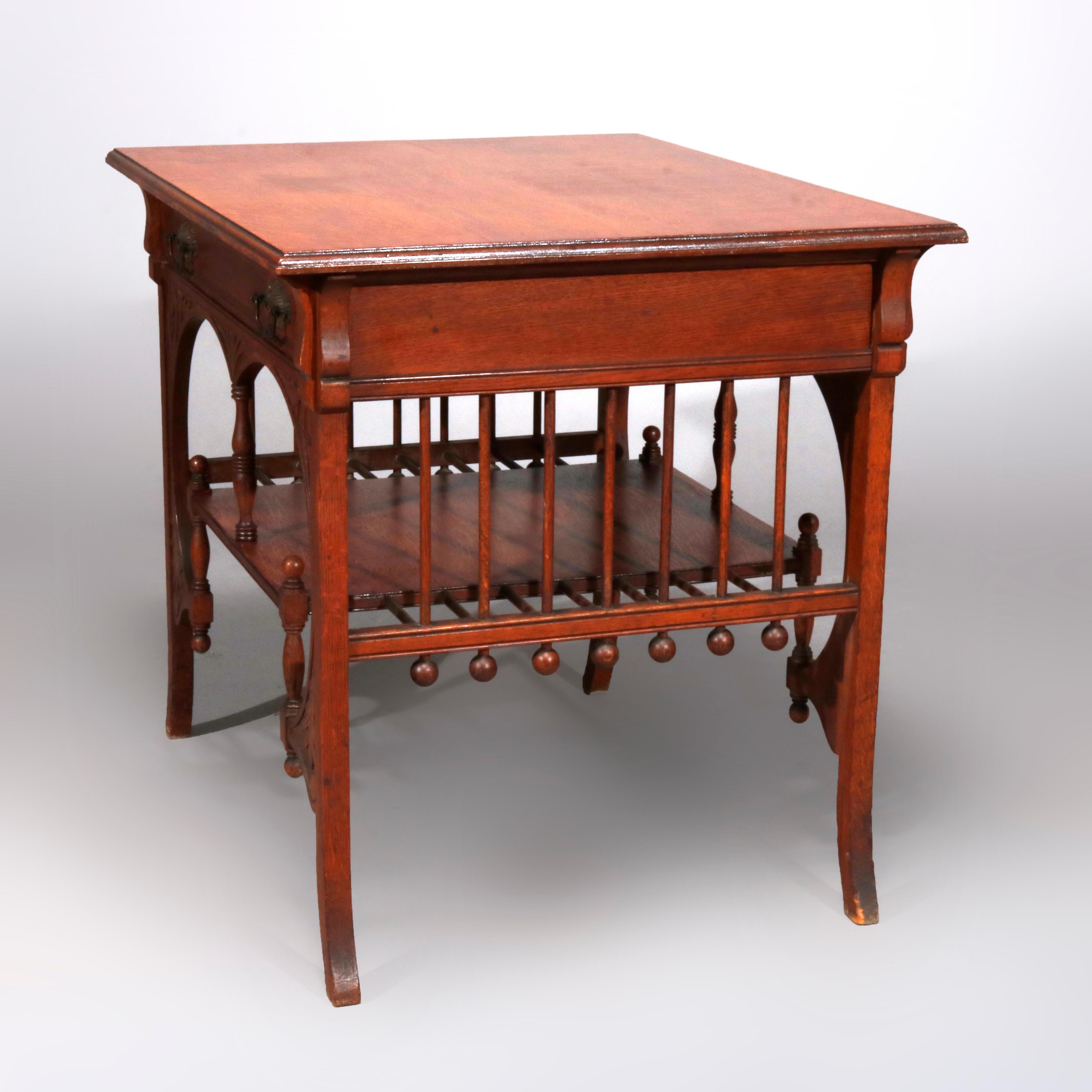 An antique library table in the manner of R J Horner offers oak construction with beveled work surface surmounting base with frieze drawer flanked by corbels having carved foliate decoration, lower shelf supported by stick and ball elements, circa