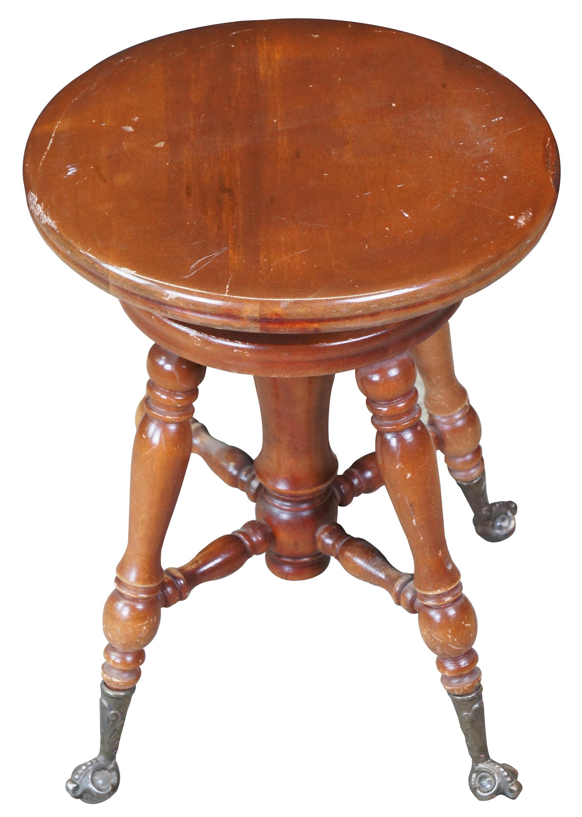 Racine Mfg Co piano stool. Circa 1909-1925. A classic Victorian design supported by metal talon feet hold glass balls

Diameter of Seat - 14.5