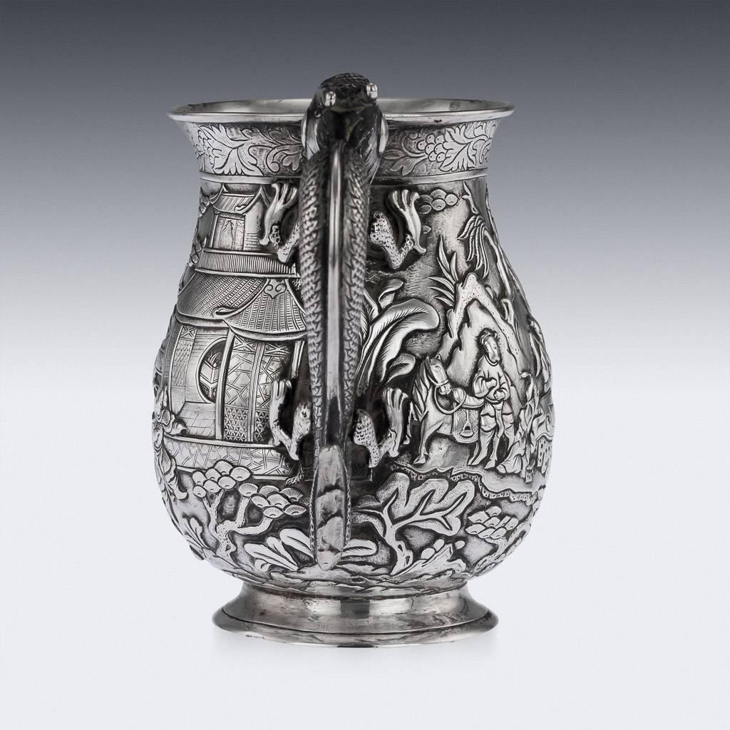 Antique 19th century Chinese export solid silver mug, of large size, baluster form, the body is embossed with beautifully battle scenes in relief depicting warriors fighting and people of nobility playing a game amongst hills and trees, the top rim