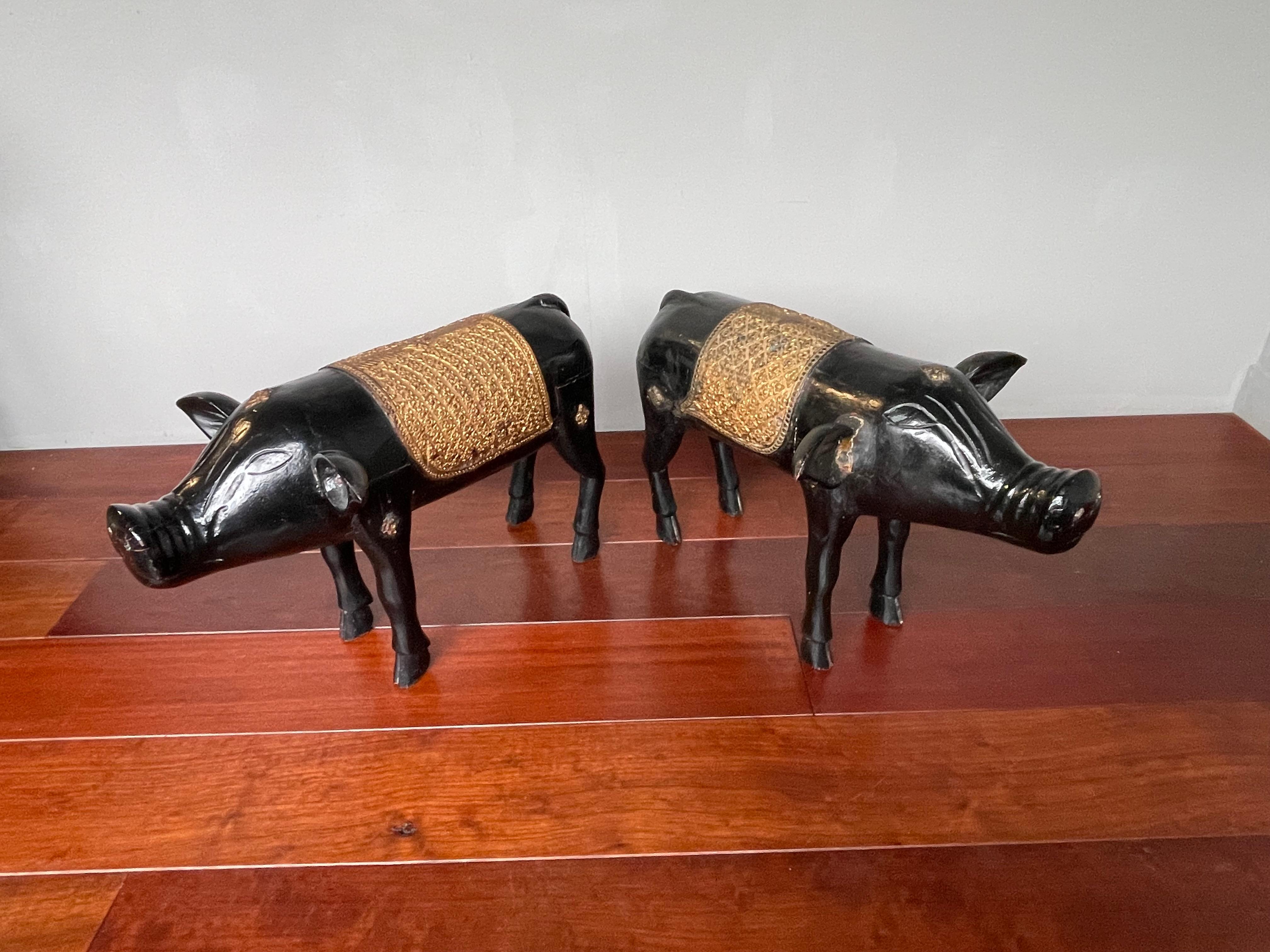 Stunning and possibly unique pair of matching pig sculptures. Ceremonial?

When we searched the internet for what it is that pigs symbolize, this is what we found: ' A pig represents luck, overall good fortune, wealth, honesty, general prosperity,