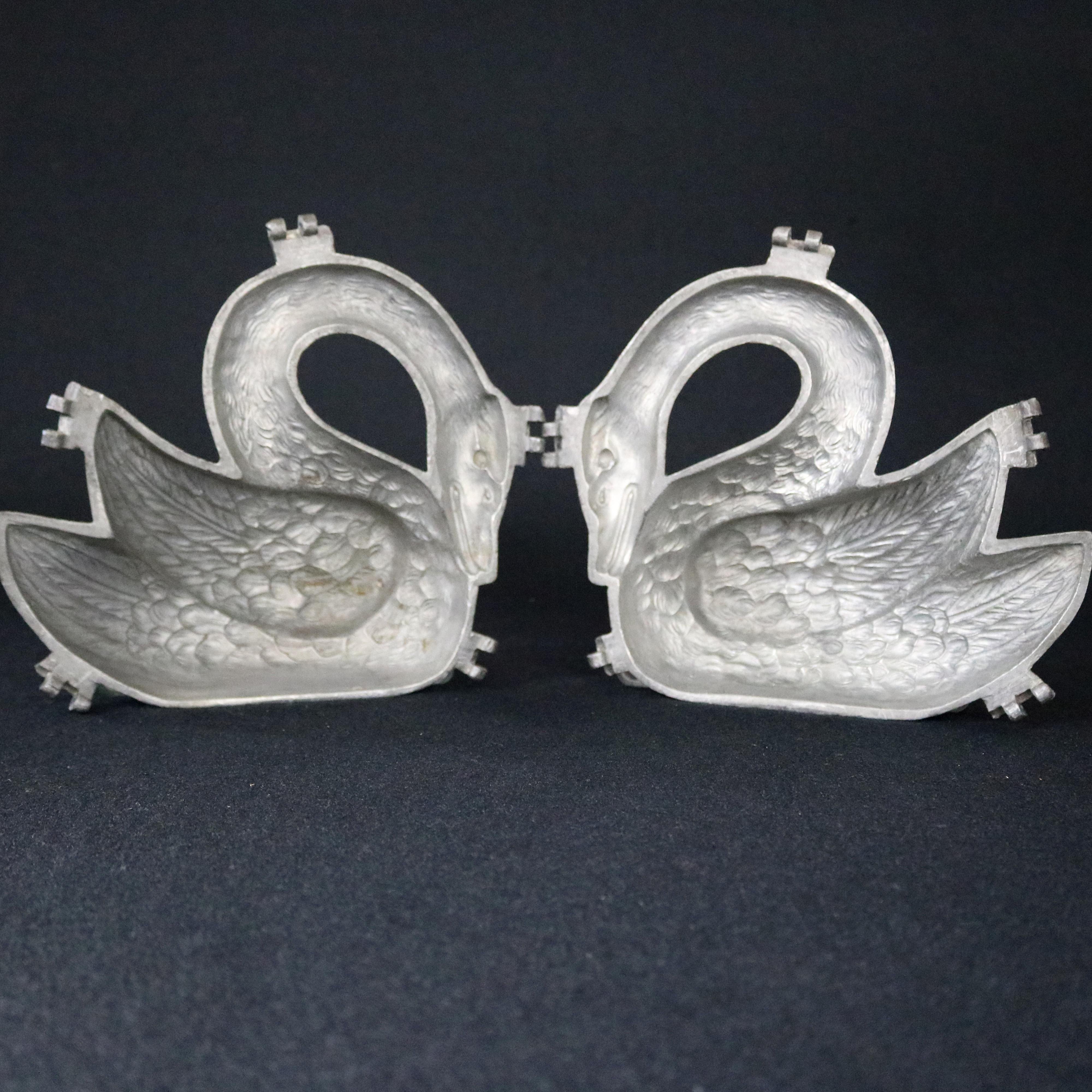 An antique and rare figural ice cream mold offers lead construction in 3-D sculptural swan form with highly detailed interior, 19th century

Measures: 8