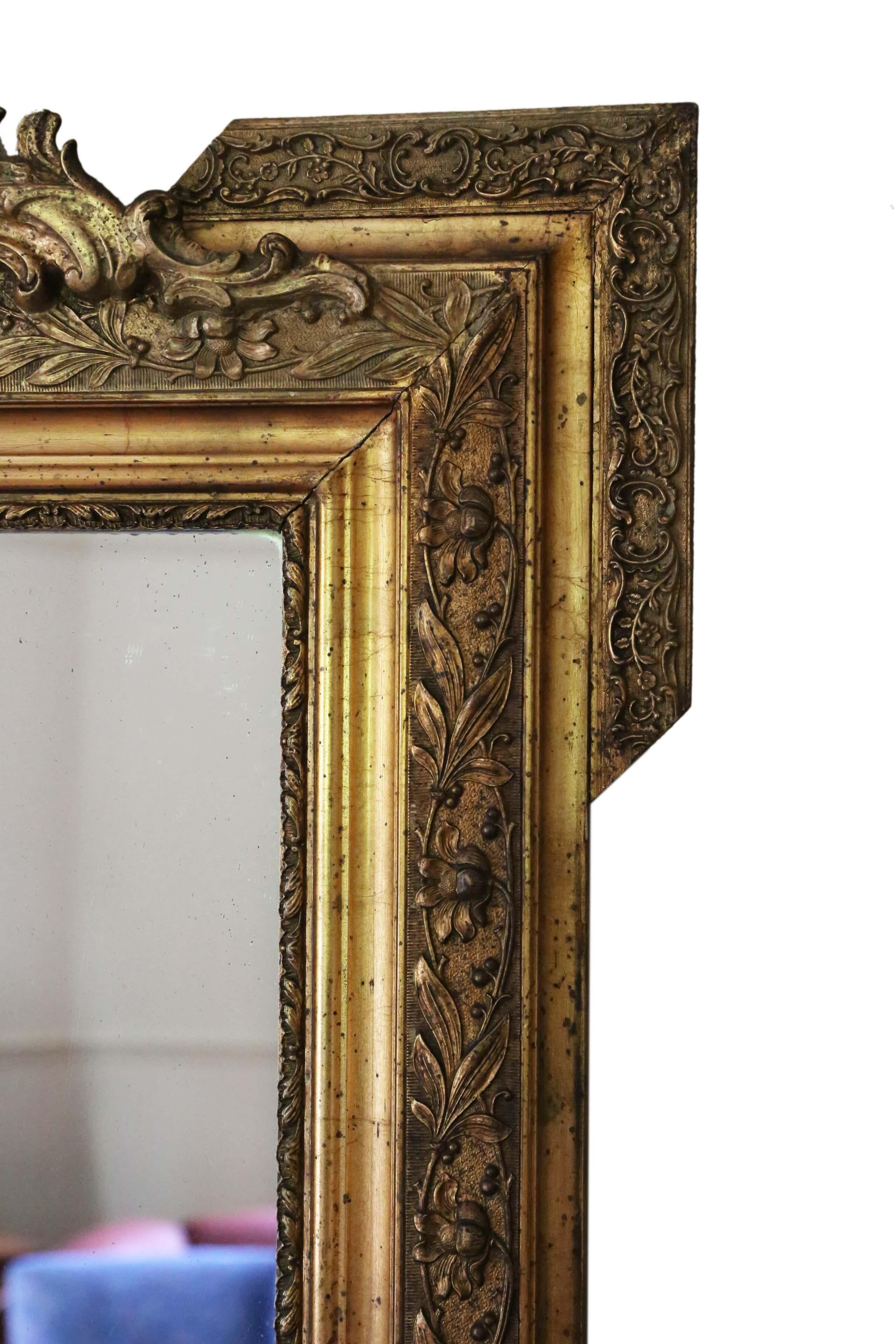 Antique rare fine quality gilt overmantle or wall mirror circa 1900. Lovely charm and elegance. Original finish.

Great finely detailed frame in very good condition, with original gilding.

An impressive and rare design, that would look amazing