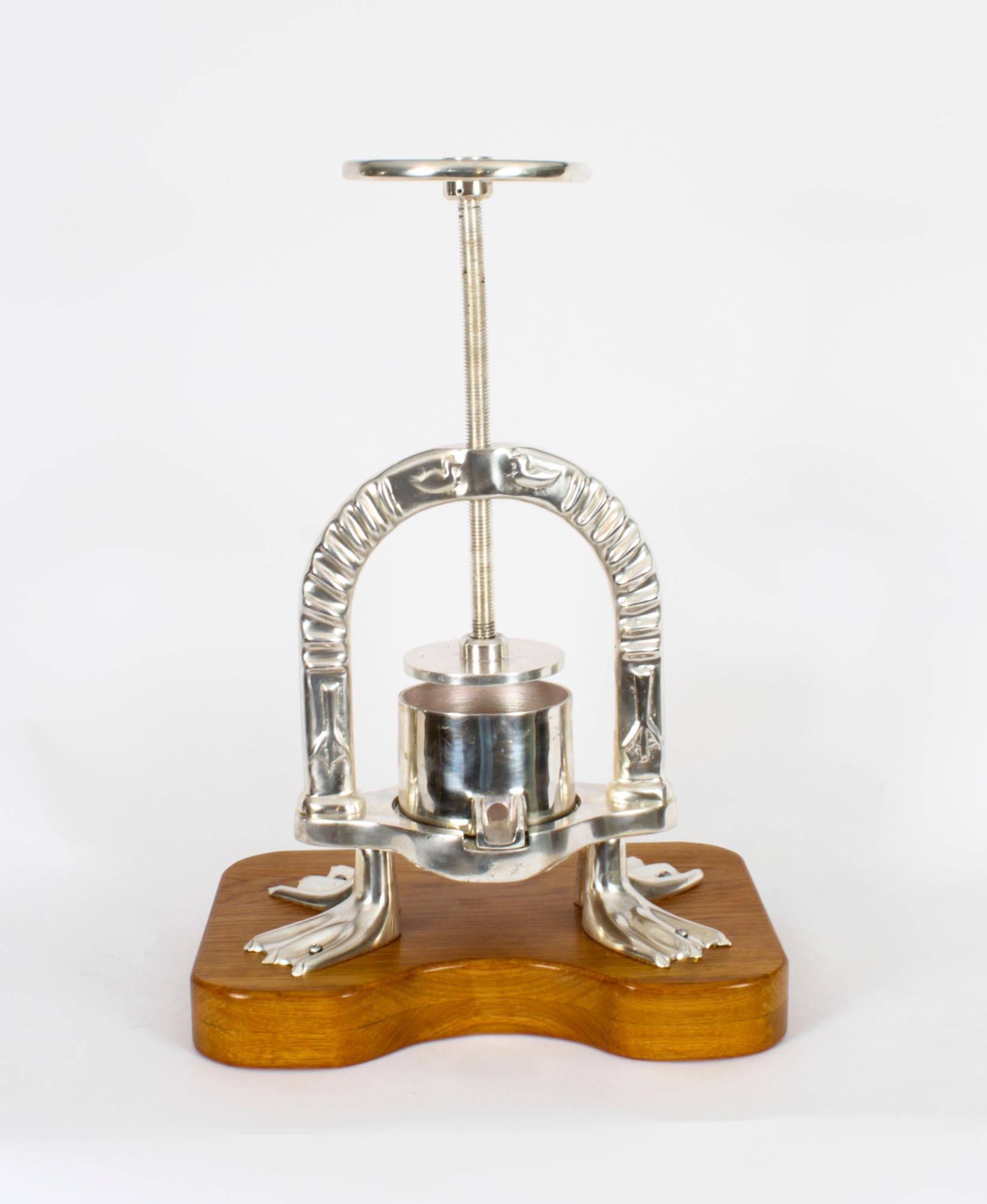 This is a fine substantial antique French silver plated Duck Press, late 19th century in date.
The duck press has decorative embossed decoration, with ducks, etc, and stands on four substantial legs fashioned as webbed duck feet. It is mounted on a