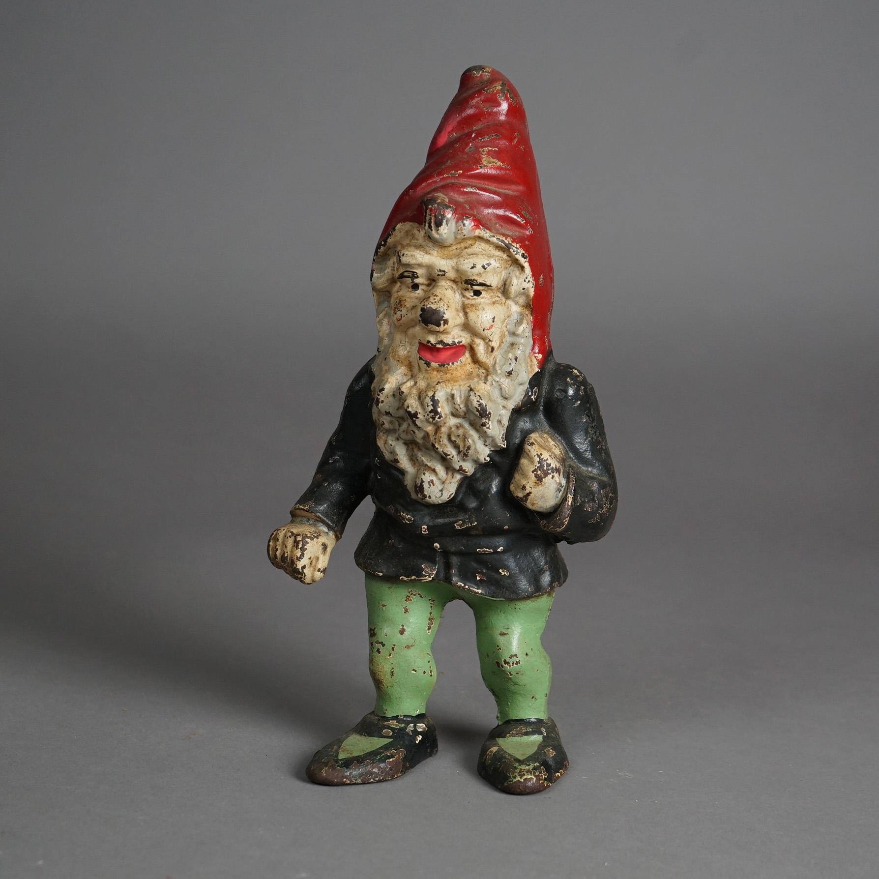 An antique and rare figural Hubley door stop offers cast iron construction in gnome form, painted, 19th century

Measures - 10.75