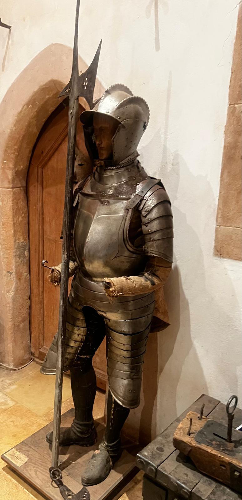 An exceptional and extremely rare complete set of Italian infantry armour from the 16th century, featuring a finely crafted triple-comb burgonet helmet with hinged ear flaps for improved hearing. The helmet retains its original character and