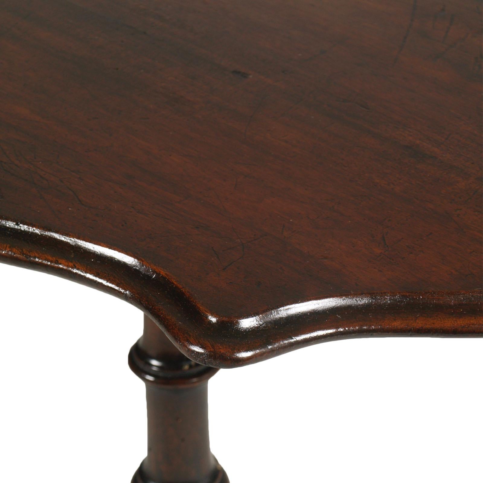 This is an antique Italian rare and elegant tilt-top table, side table, coffee table in carved and turned solid walnut find in Asolo -Treviso, restored and wax polished.

This table is raised upon a four legs, supporting a turned column.
The top
