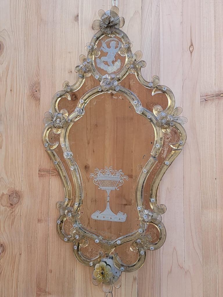 Antique Rare Italian Venetian Etched floral glass wall mirror - set of 2 

Beautiful Rare Venetian etched glass mirrors with hand blown glass decorative flowers and etched images. Wooden backs. Sure to make a statement.

Circa