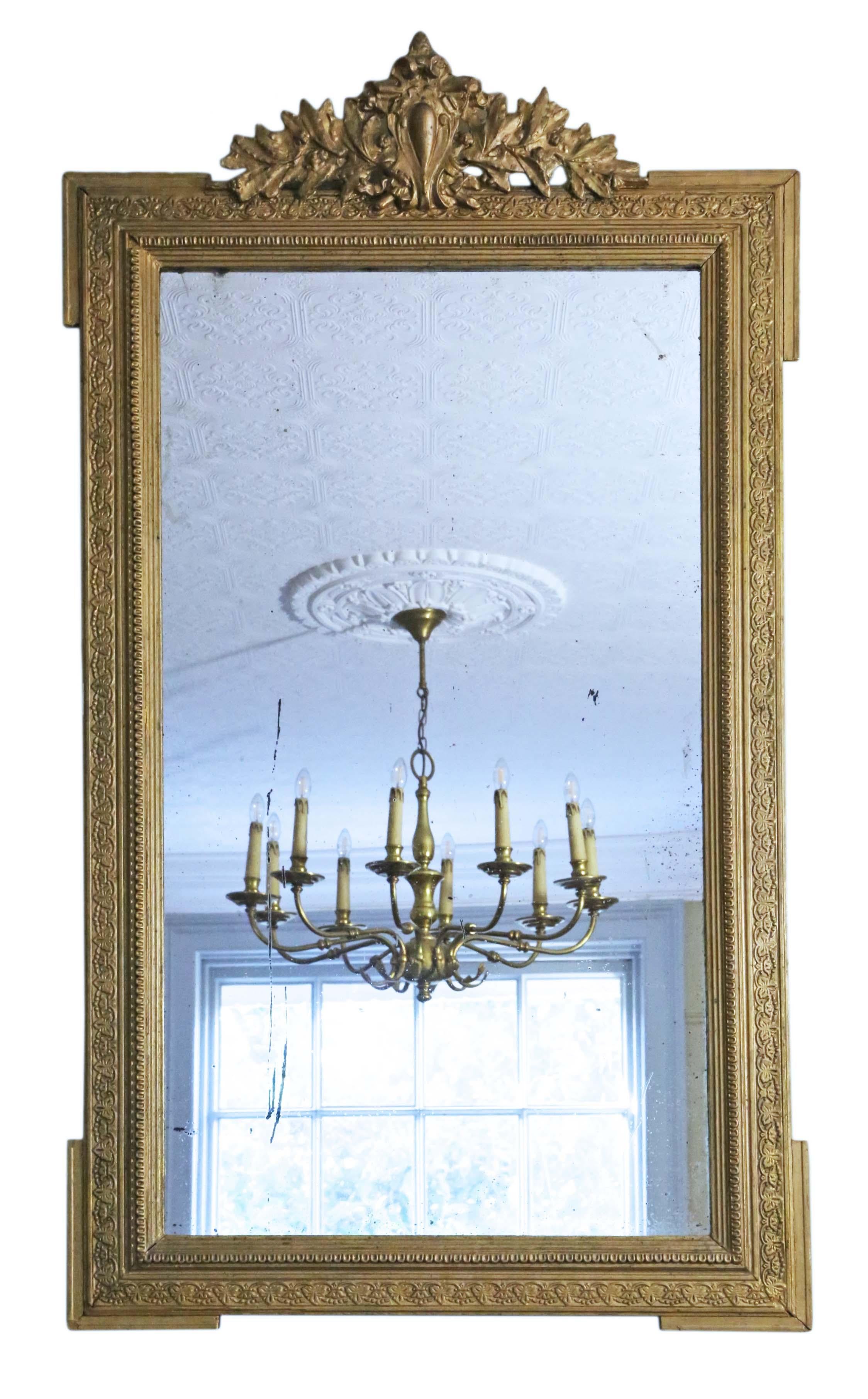 Antique rare large fine quality 19th Century gilt overmantle or wall mirror. The mirror has its original glass and back. The frame has a beautiful original gilt finish with patina, minor losses and touching up here and there.

An impressive find,
