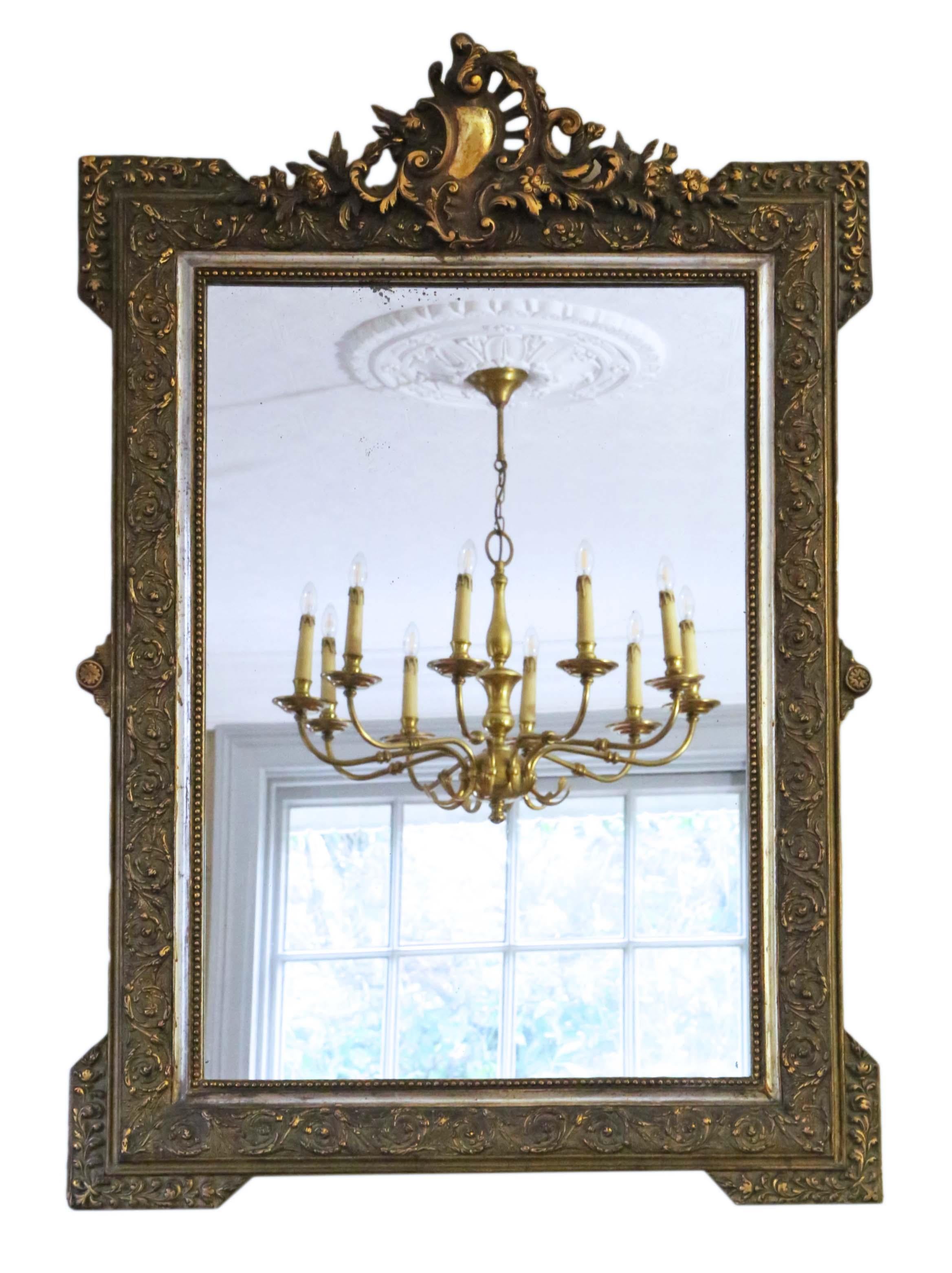Antique rare large fine quality French 19th century gilt overmantle or wall mirror. The mirror has its original glass and back. The frame has a beautiful original finish with patina, minor losses and touching up.

An impressive find, that would