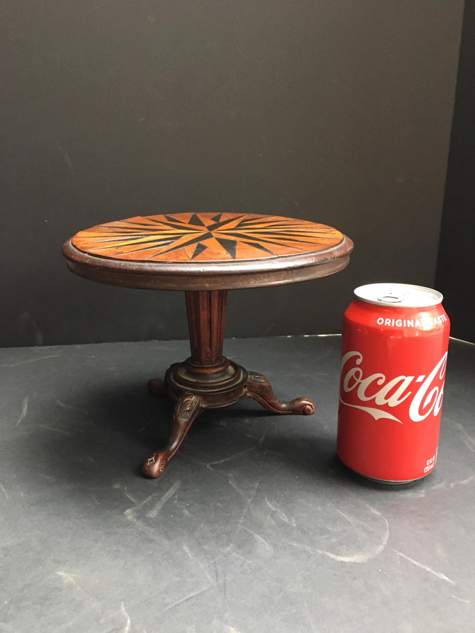 Antique extremely rare miniature marquetry tilt-top table. Probably Ralph Turnbull (1788-1865)

This beautiful little gem from the early 19th century is a ‘tour de force’ of marquetry. It is probably made by the notable cabinet maker Ralph