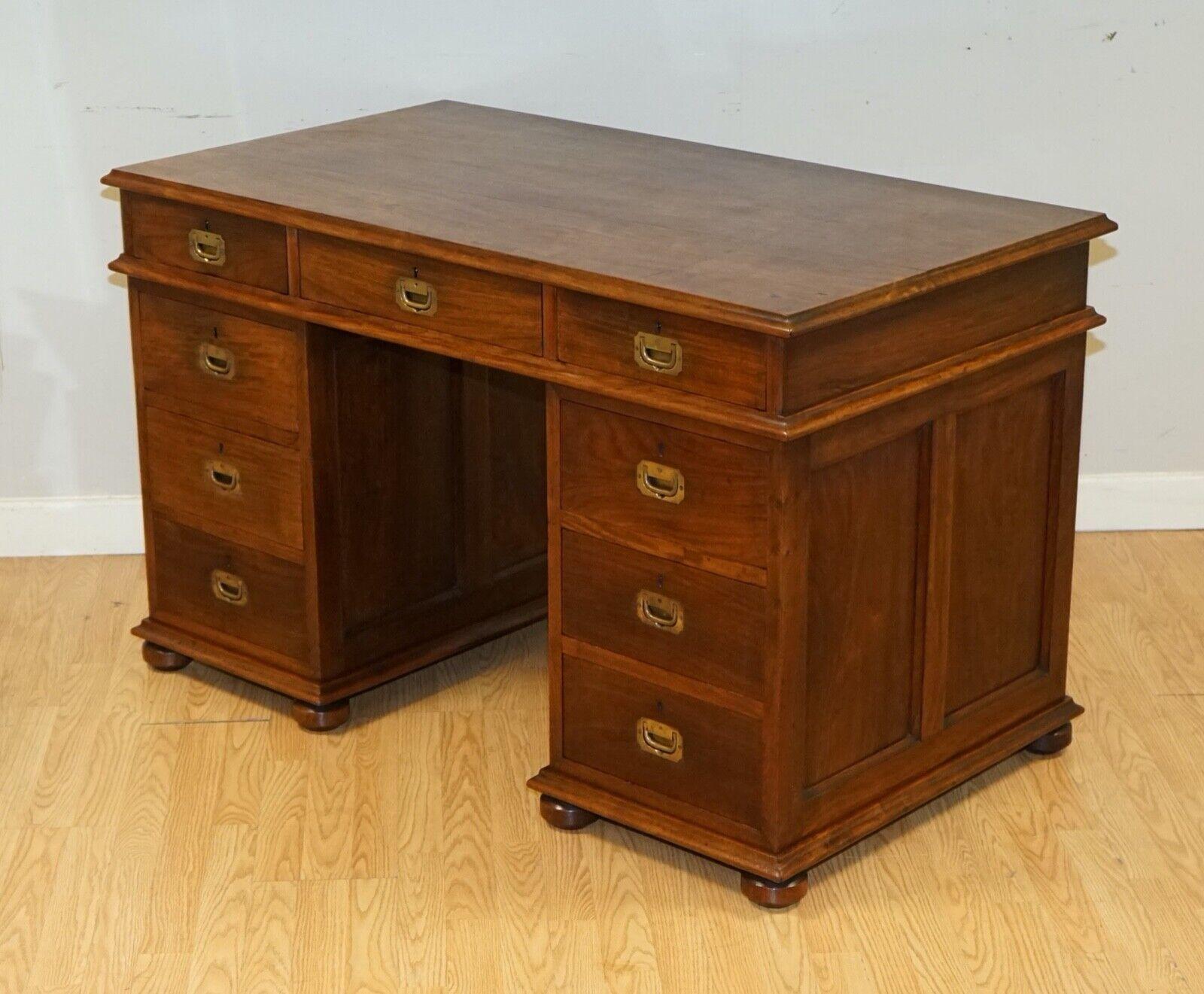 The Antique Rare Victoria Regina Military Campaign Pedestal Desk, circa 1880, is a truly exceptional piece of furniture that marries style, functionality, and historical significance. 

Crafted during the reign of Queen Victoria and inspired by