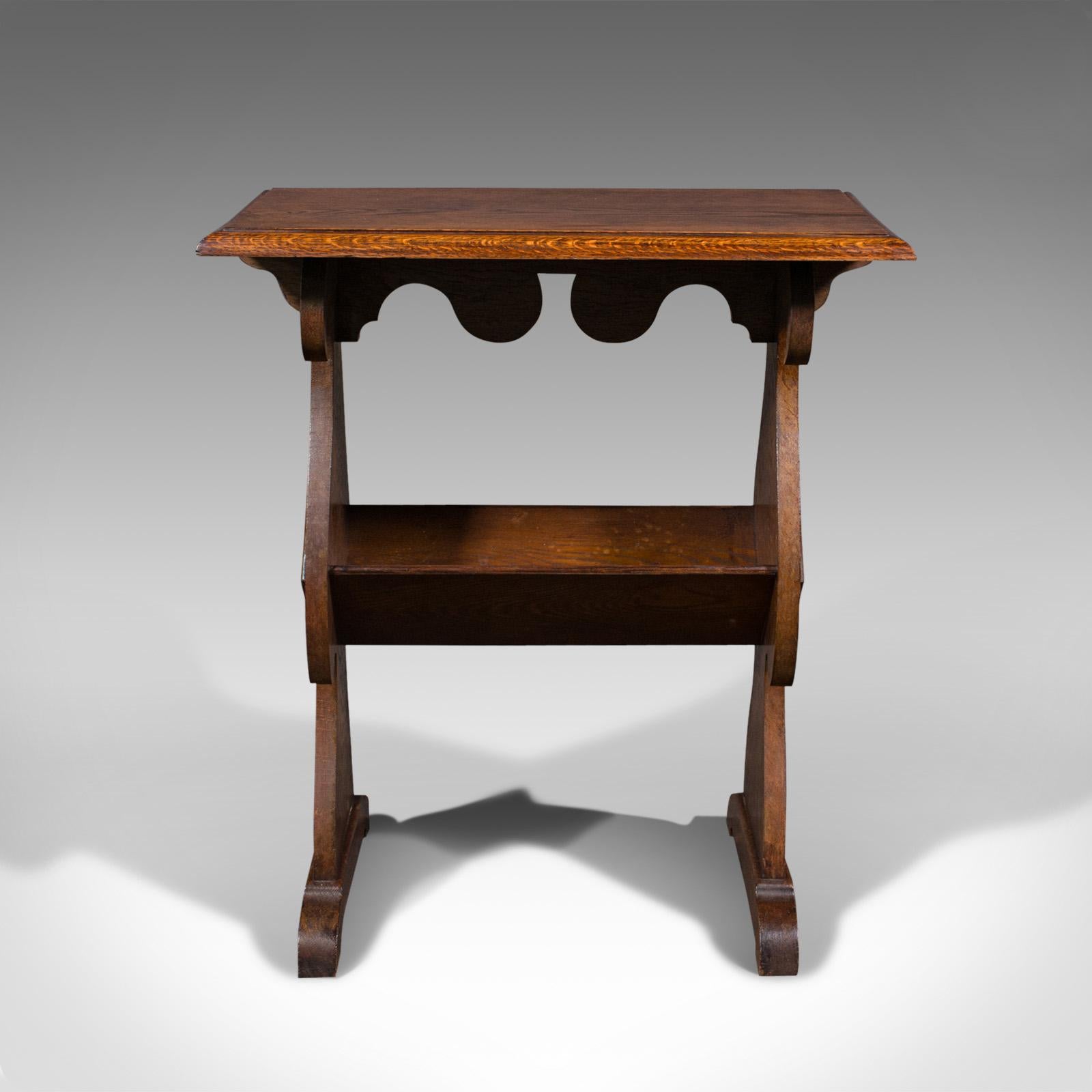 This is an antique reader's stand. An English, oak side table with book trough, dating to the Edwardian period, circa 1910.

Wonderfully sized for an intimate reading nook
Displays a desirable aged patina and in good order
Select oak shows