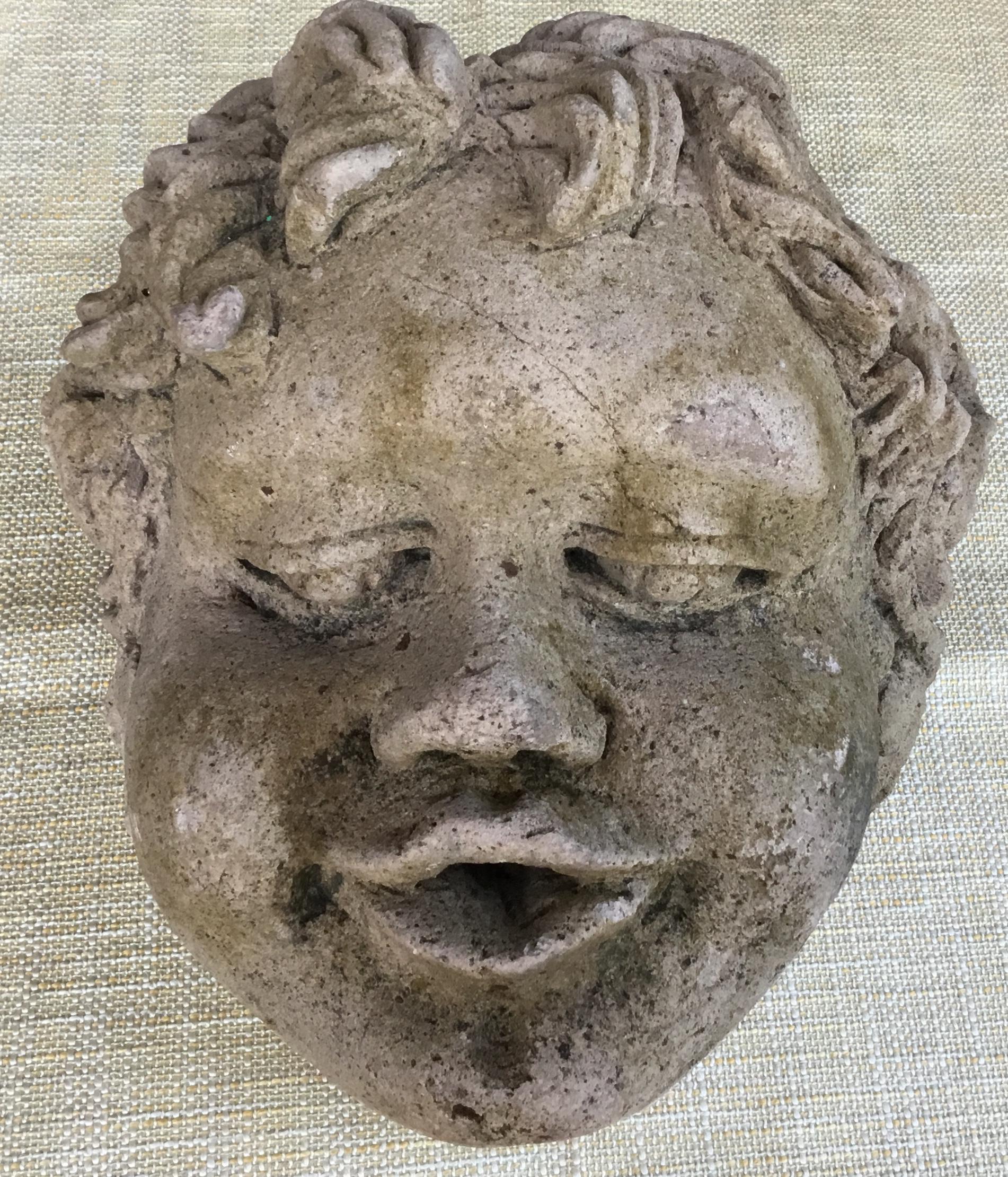 Exceptional large cherub head made of hand carved sand stone, beautiful facial expression, this piece waste used as wall-mounted fountains head, or could be use as table decoration if mounted on a
Base. Base is not included.