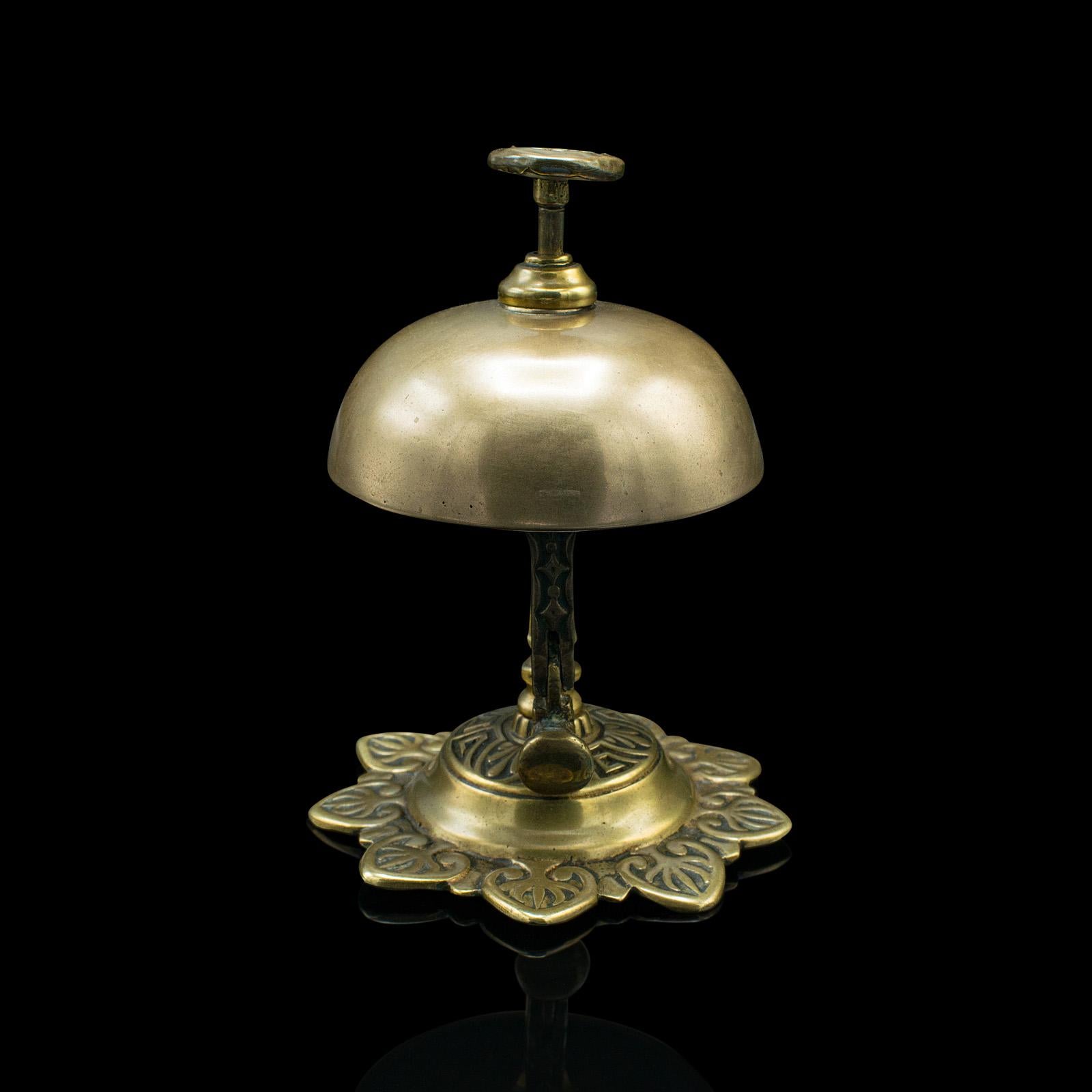 This is an antique reception bell. An English, brass country house hotel push button bell, dating to the late Victorian period, circa 1900.

Charming counter-top bell, ideal for a working reception desk
Displays a desirable aged patina and in good