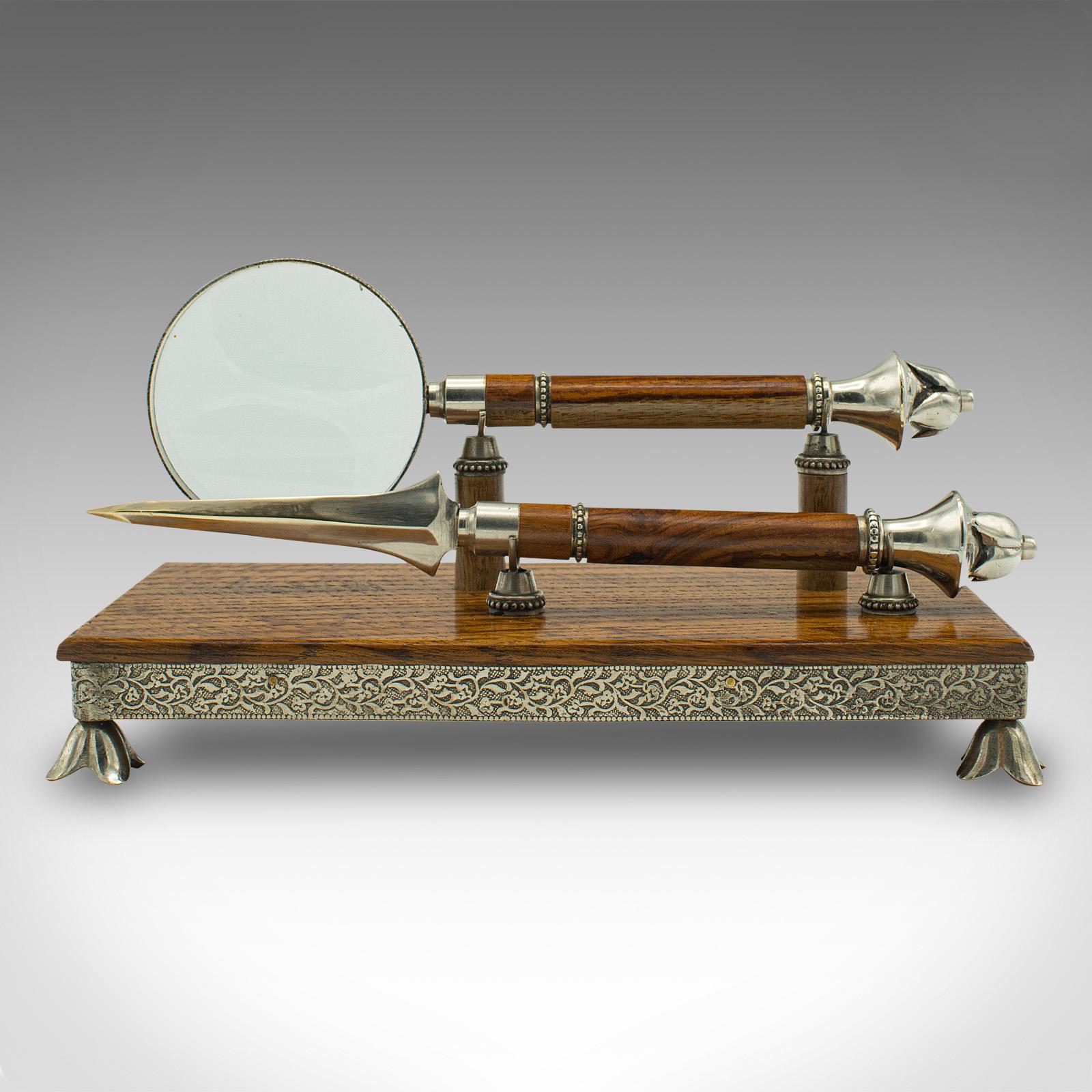 This is an antique reception desk letter set. An English, walnut and oak magnifying glass and letter opener on a stand, dating to the late Victorian period, circa 1900.

Beautifully crafted set, adding a touch of distinction to the
