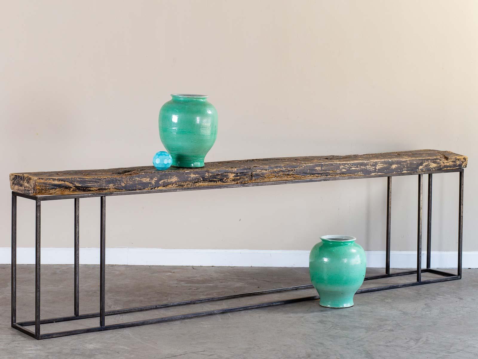 This massive antique architectural beam, circa 1850 has been repurposed as a console server table with a custom modern steel framed base. Please enlarge the photographs to see the awesome effects of the passage of time on this huge section of