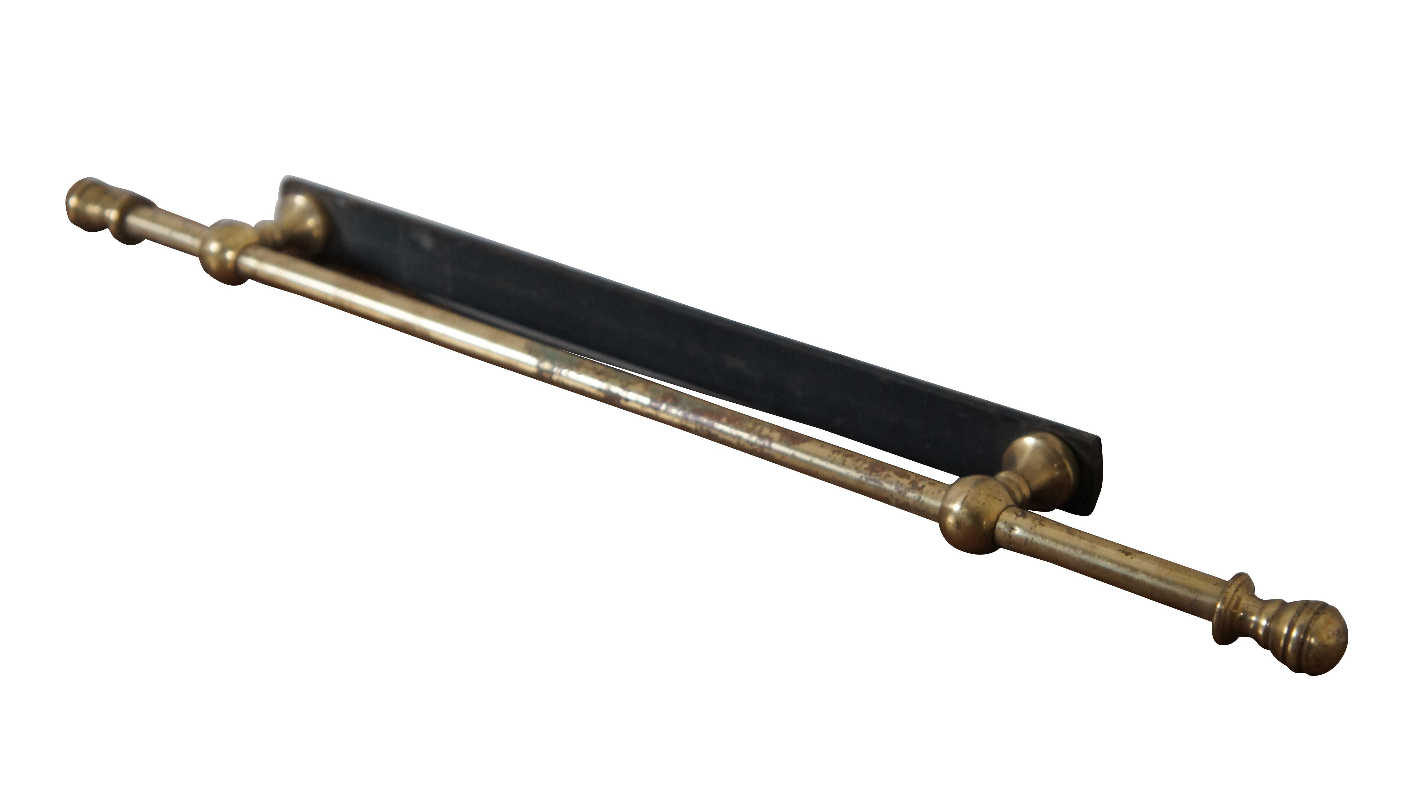 Antique brass towel bar / rack / holder featuring round turned finials and iron support.

Dimensions:
18.25