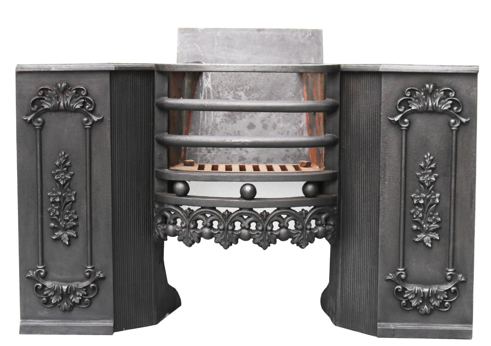 An antique Georgian hob grate made from cast iron. Complete and ready to fit, this hob grate is unusually decorated with foliage to the front, accompanied by thick shaped bars.
Finished in black graphite polish, this antique cast iron hob grate will
