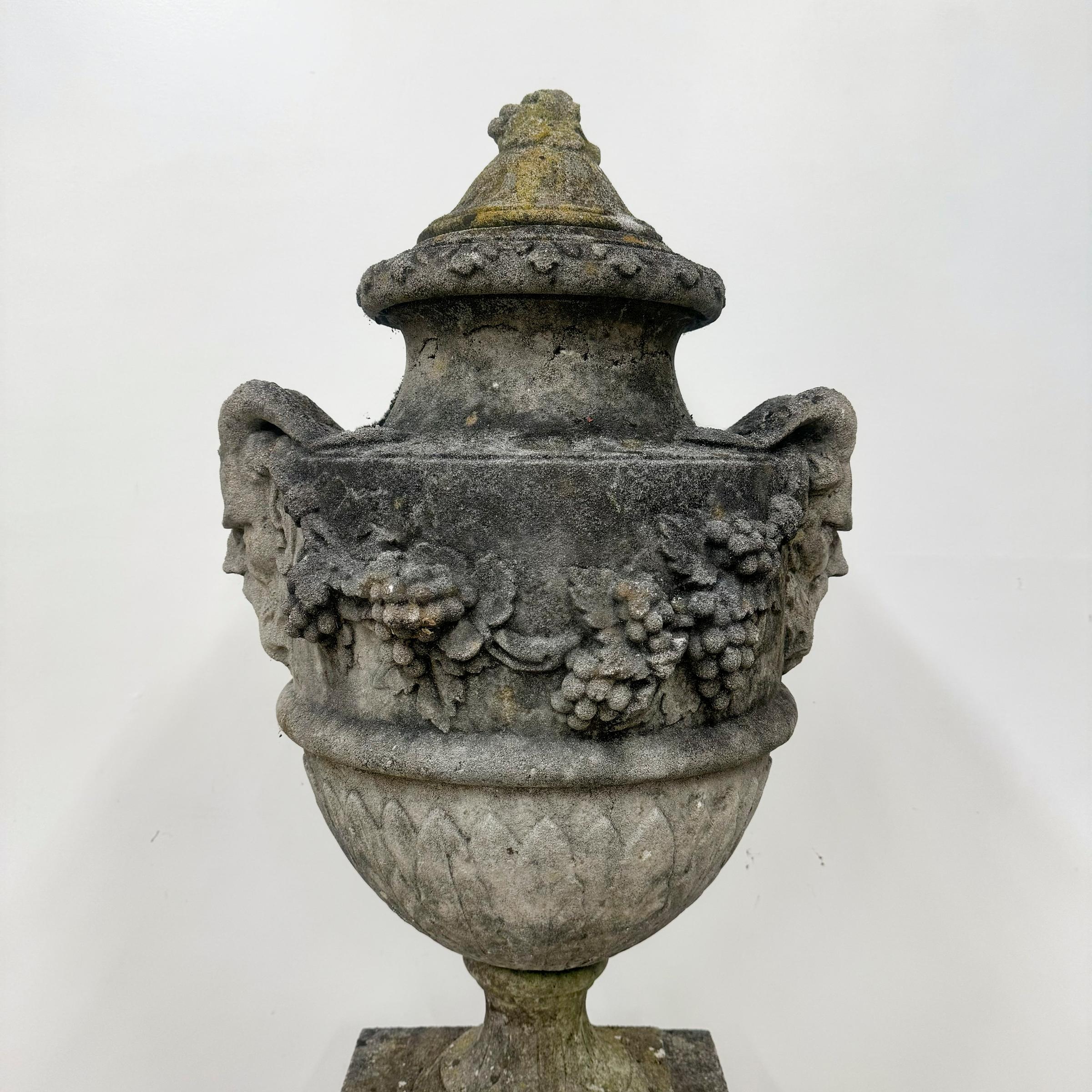 A single reclaimed reconstituted stone Bacchus Urn.

Elevate your garden with this decorative urn that features intricate details of Bacchus flourishing with grapes. Named after the Roman god of fertility & wine, these are perfectly aged and made