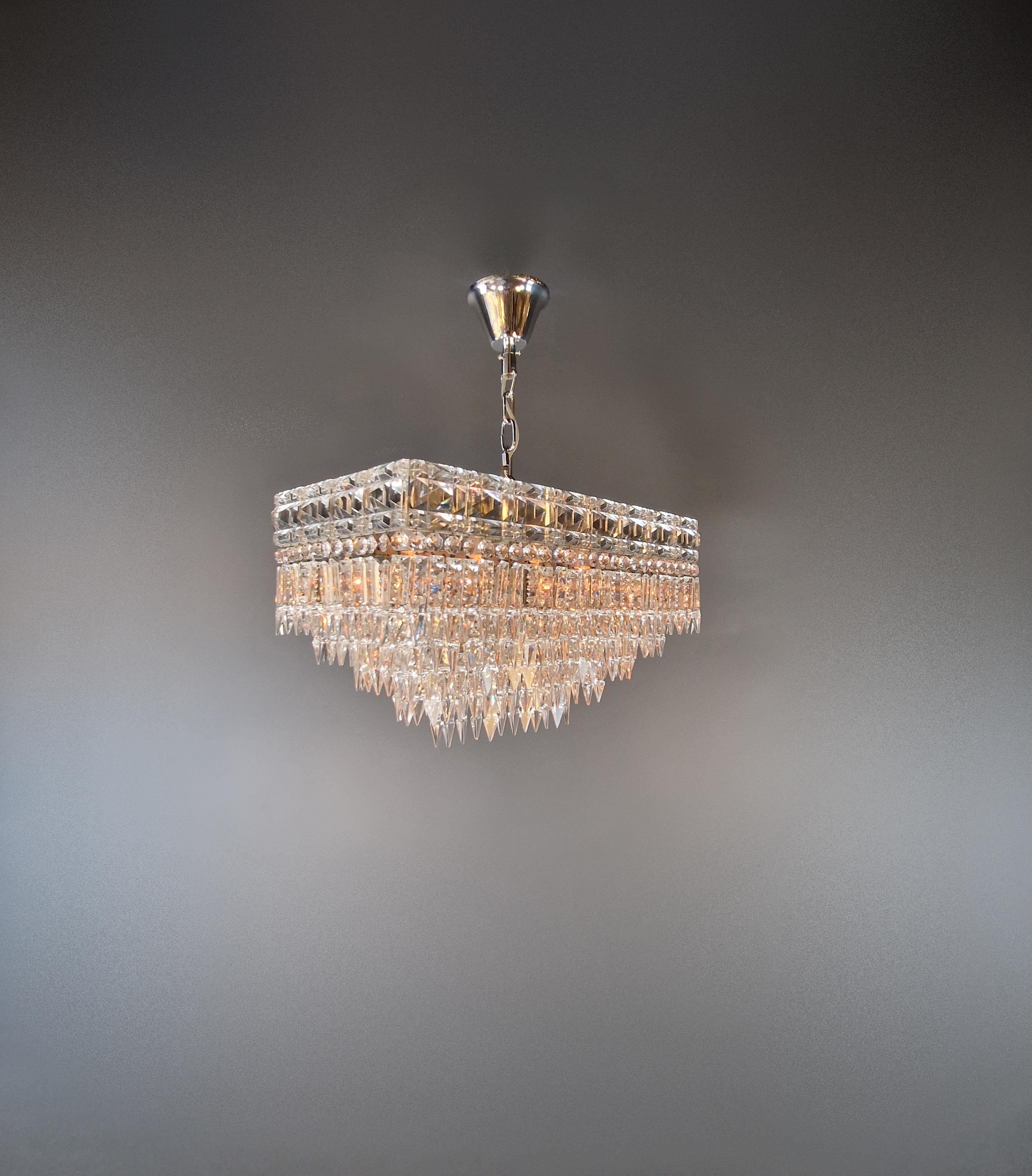 Antique rectangular Czech chandelier around 1930 in silver, restored

For sale is a beautiful, original chandelier from the Czech Republic, made around 1930. This unique piece impresses with its elegant, rectangular design and its noble silver