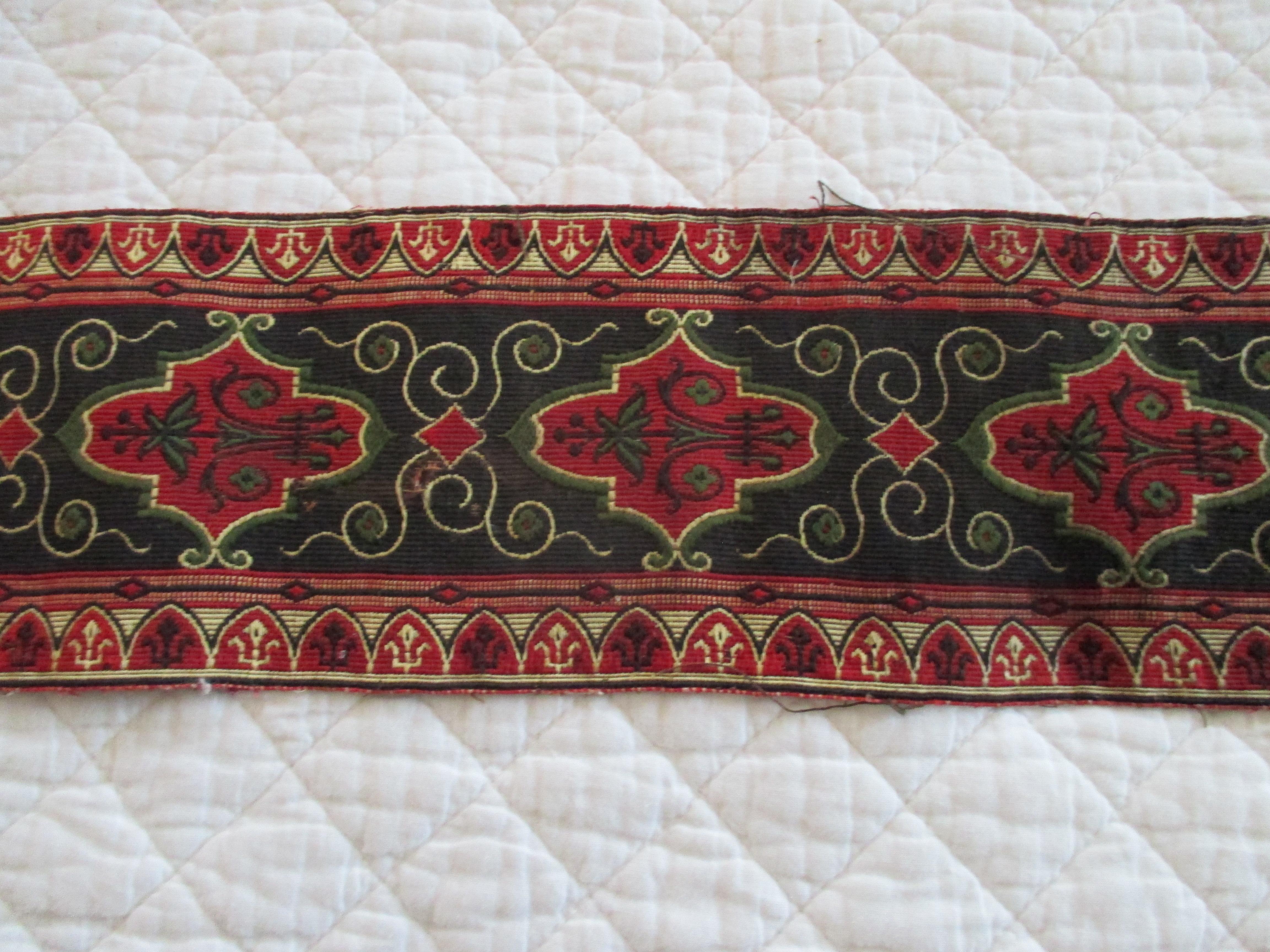 Antique red and black woven tapestry style trim.
Traditional floral pattern in shades of black, green, red and gold.
Ideal for pillows, curtains and upholstery.
Size: 76
