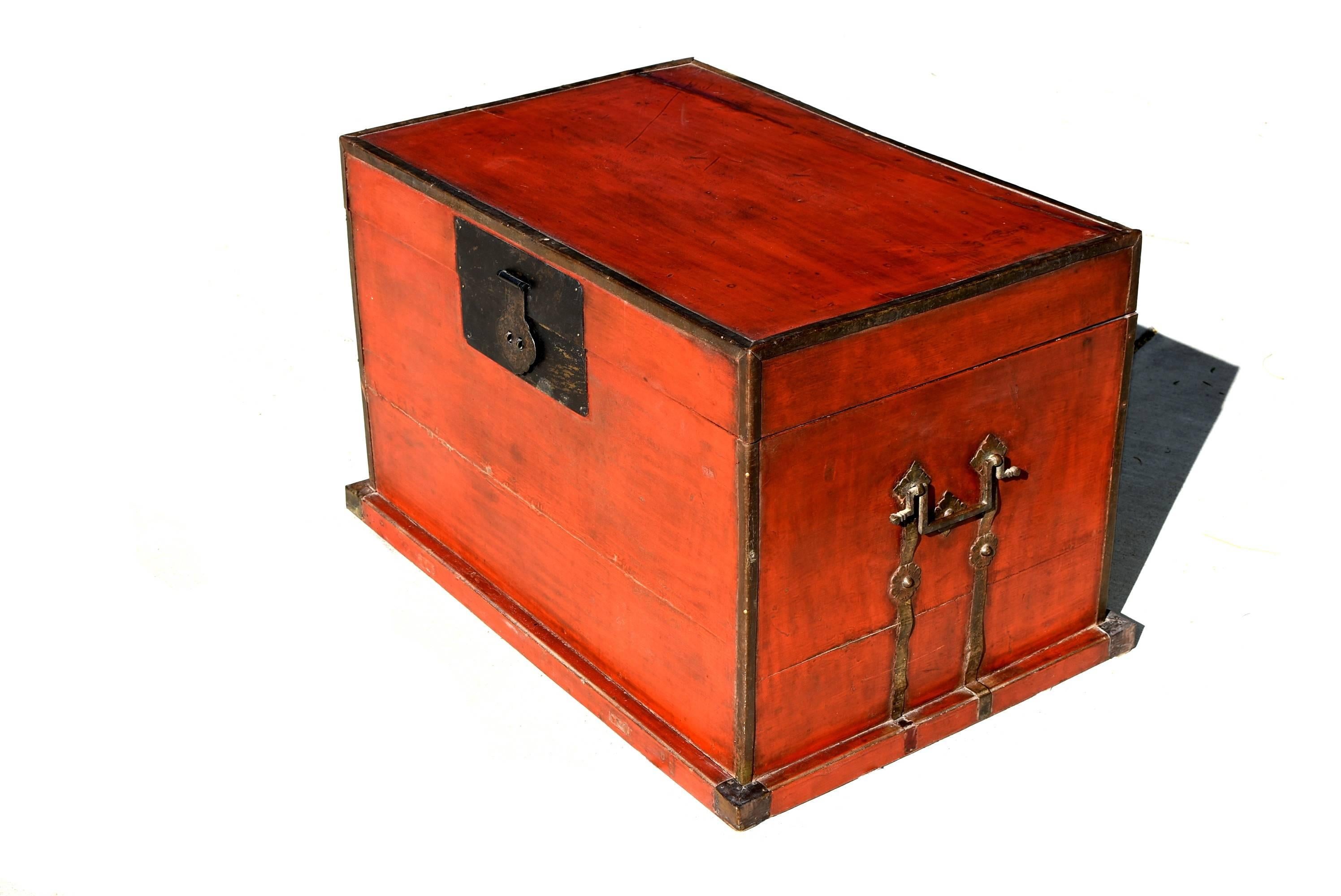 This beautiful trunk is all original, with gorgeous red interior and custom northern style bronze hardware. Reinforced trim, base and corners. Original top and exterior display beautiful patina. 

Fantastic as a coffee table or at foot of the