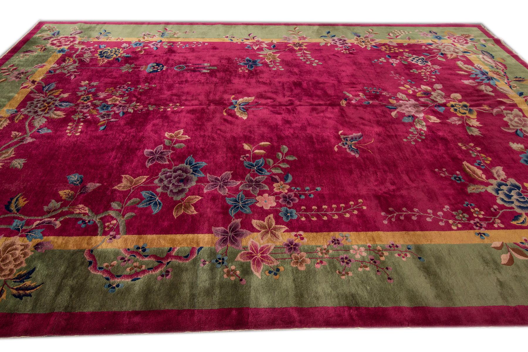 Beautiful Antique Chinese Art Deco Rug, hand-knotted wool with a red field, green frame in an allover Classic Chinese floral design.

This rug measures are: 10' x 13'.4
     