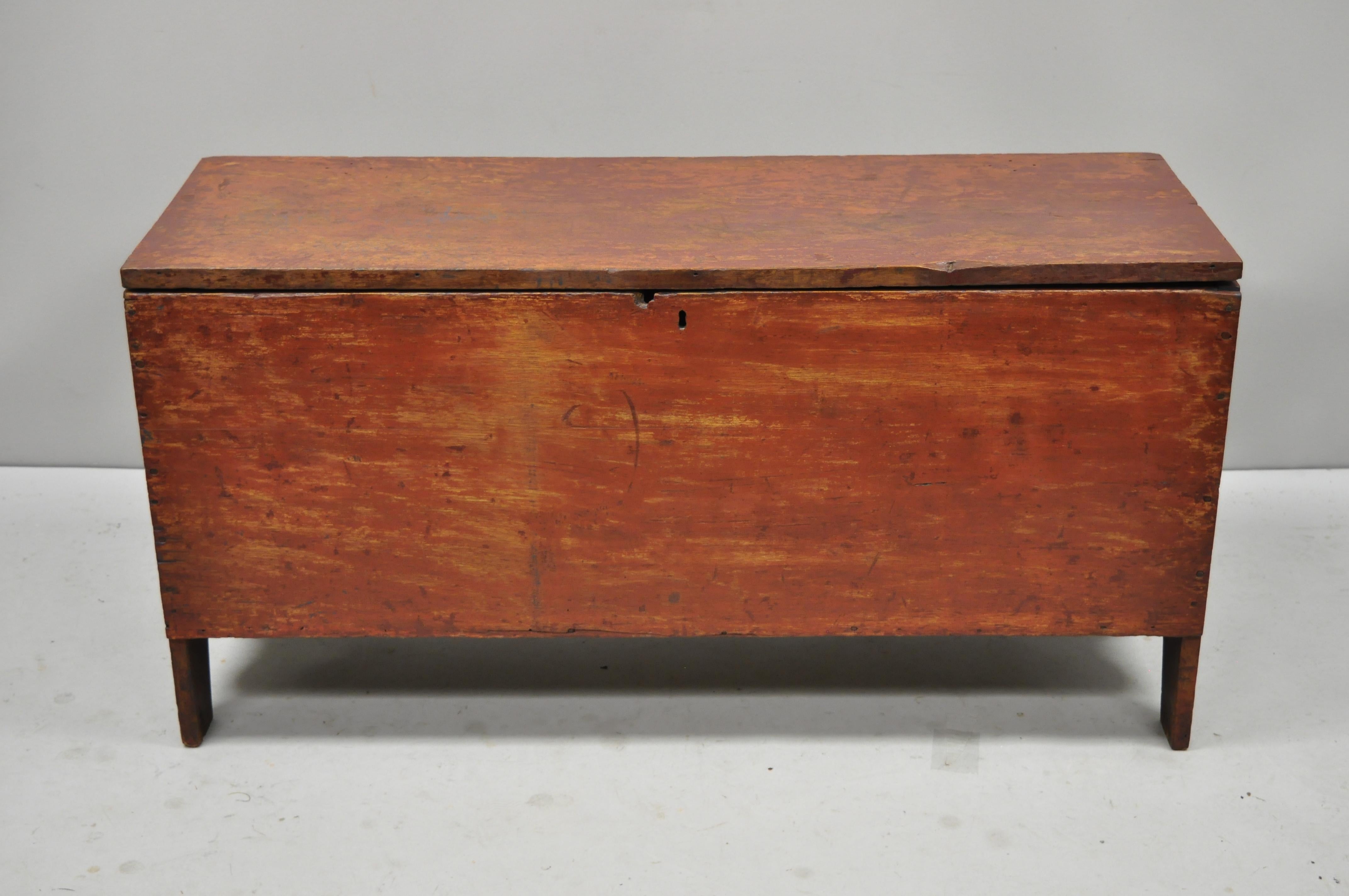 Antique 19th century red distress painted American Primitive colonial small blanket chest trunk. Item features remarkable patina to red painted finish, arch carved lower skirt, solid wood construction, distress finish, very nice antique item,