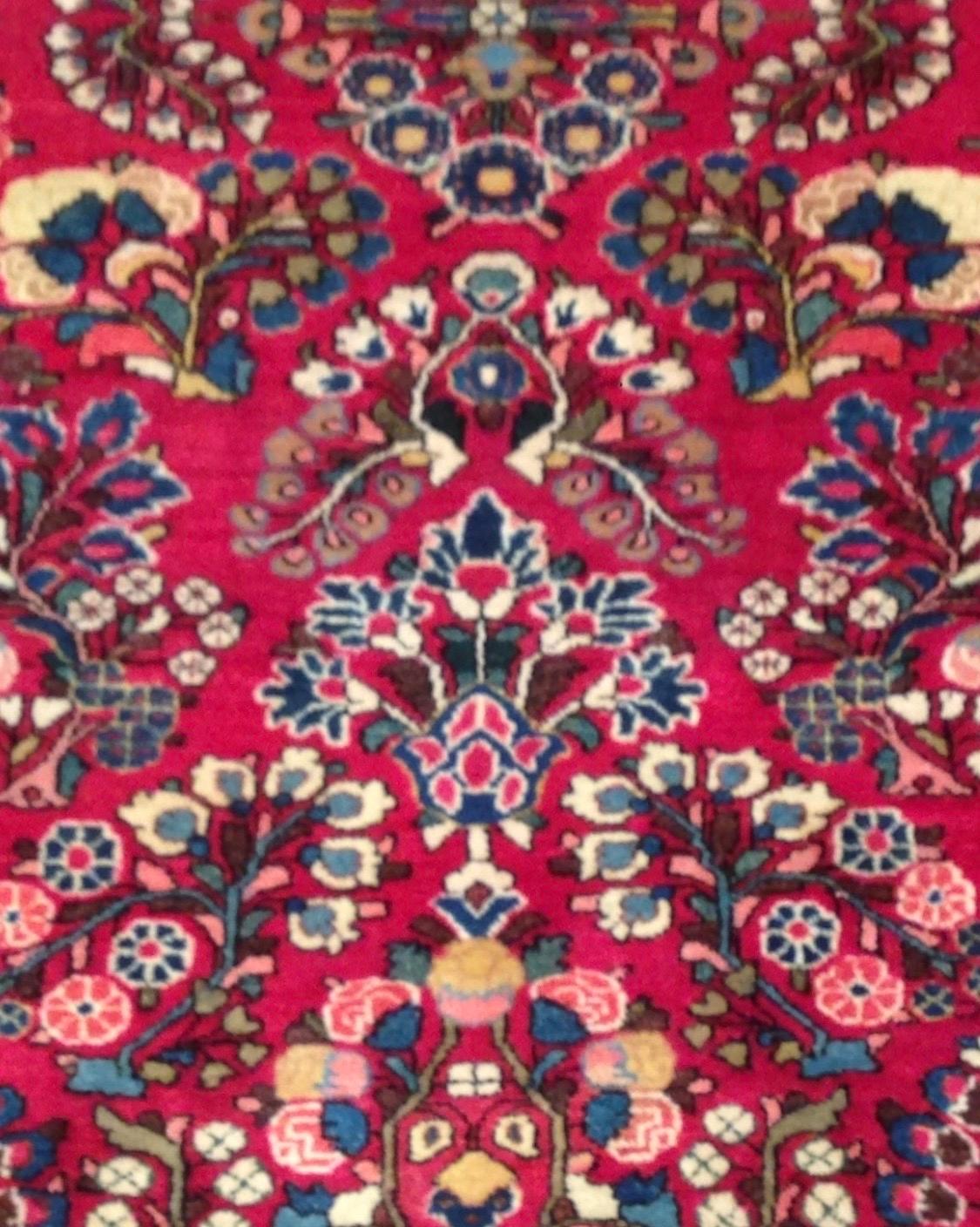 Sarouk is a small village and its neighboring villages in Northwestern Iran. Most Sarouk carpets follow a very distinctive design and is depended on floral sprays and bouquets. 

This is a fine example of an antique Sarouk carpet dating from the