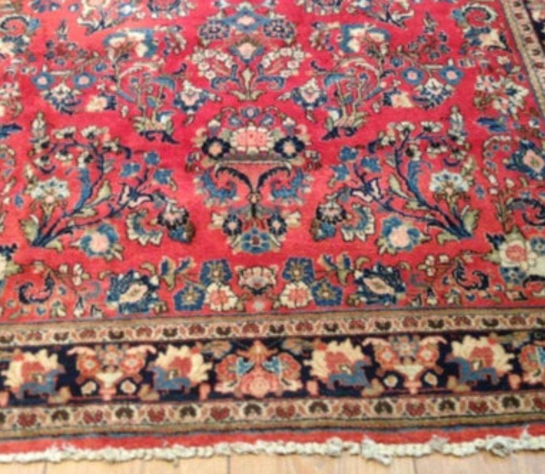 Sarouk is a small village and its neighboring villages in Northwestern Iran. Most Sarouk carpets follow a very distinctive design and is depended on floral sprays and bouquets. 

This is a fine example of an antique Sarouk carpet dating from the