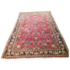 Petit tapis persan Sarouk ancien à fleurs rouges et dorées, vers les années 1930