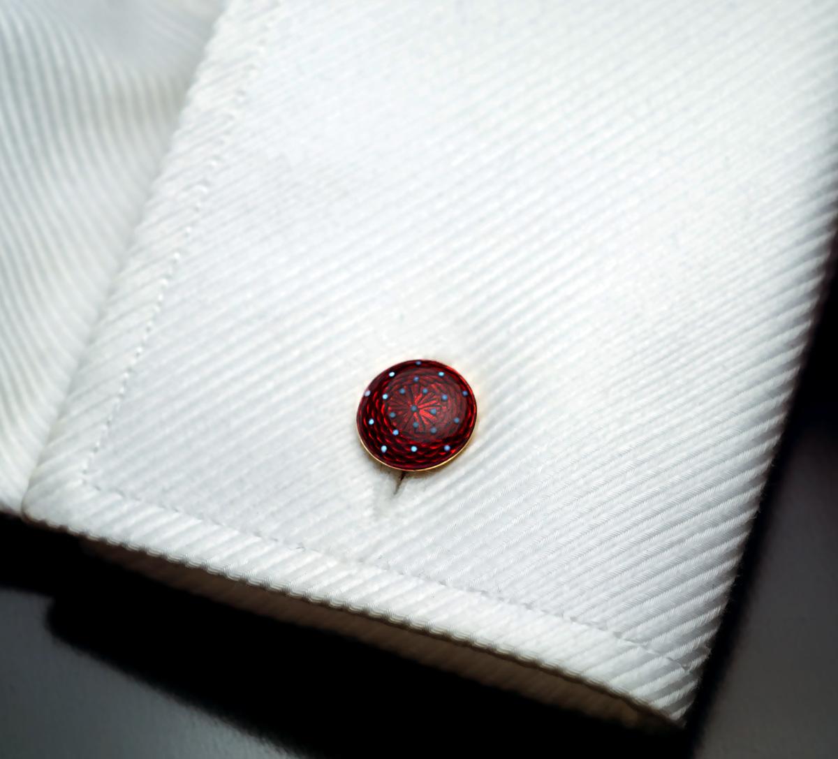 Circa 1900

A pair of chic antique double sided cufflinks is crafted in 18K yellow gold and covered with high quality deep ruby red guilloche enamel. The red enameled discs are dotted with greyish-white opaque enamel.

Marked ’18 Ct’ for 18K