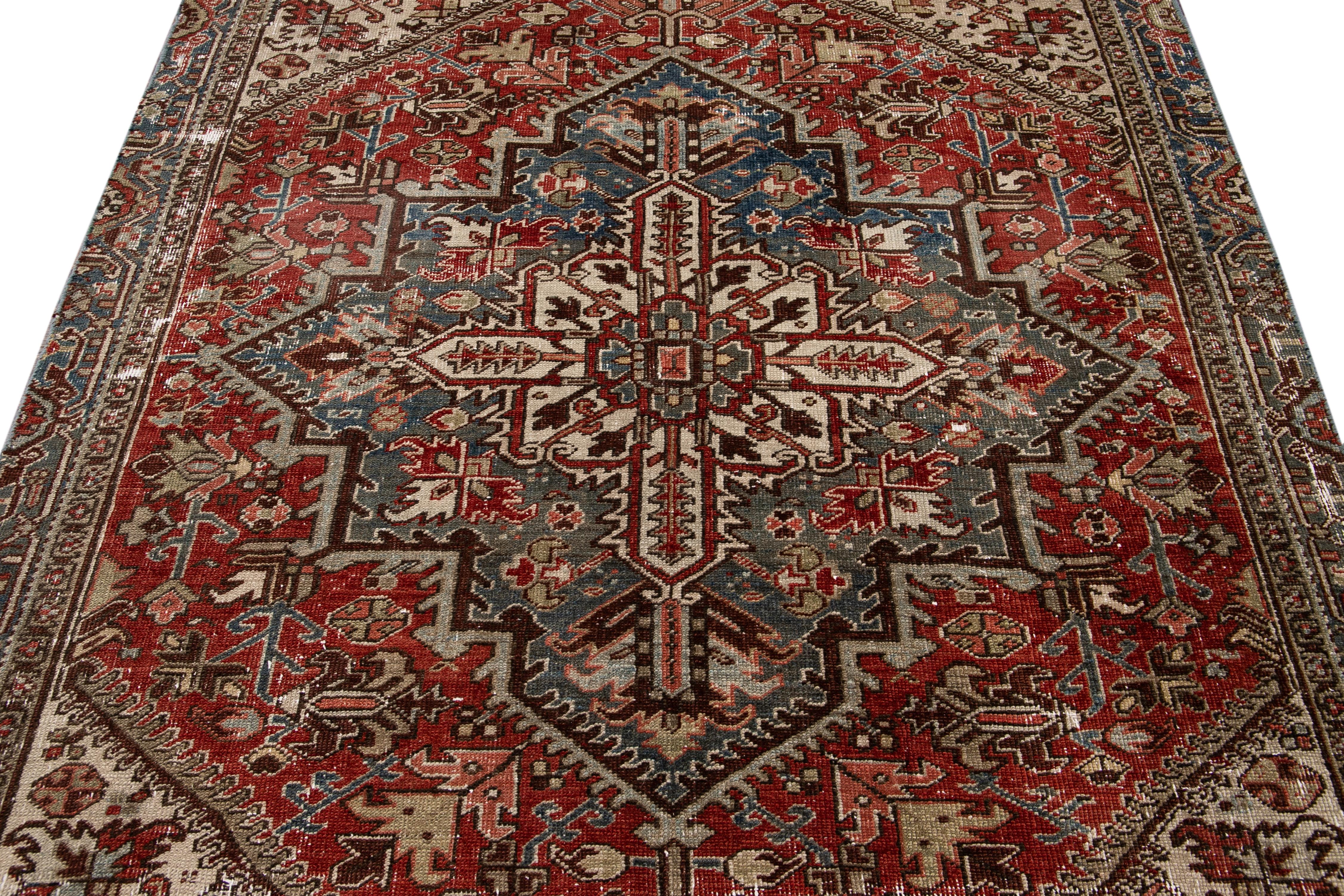 Early 20th Century Antique Red Heriz Handmade Medallion Floral Wool Rug For Sale