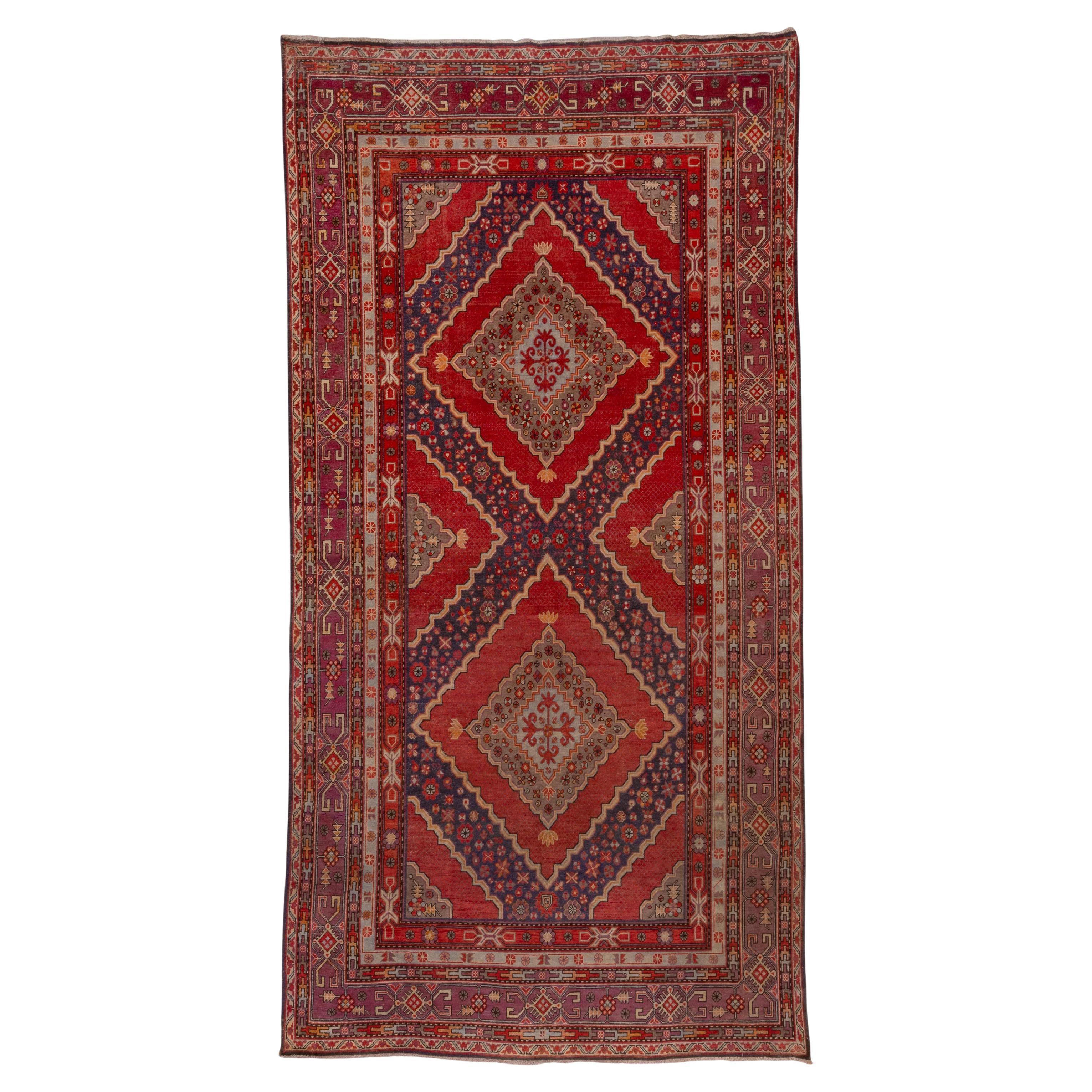 Antiker roter Khotan-Teppich, ca. 1920er Jahre