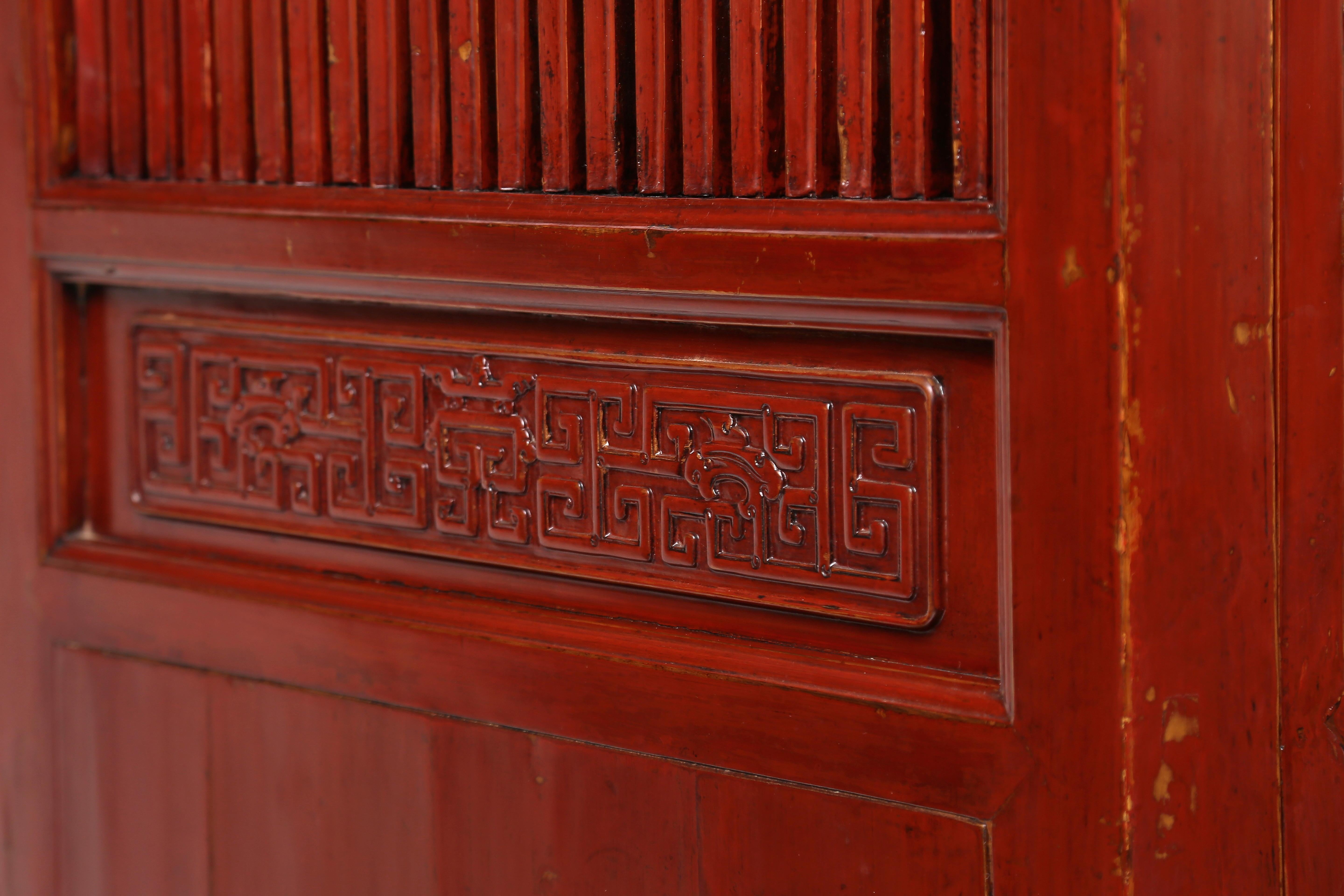 Fine red lacquer kitchen cabinet

The cabinet with an ice-plate edged top, supported on square-sectioned side posts, a pair of doors, flanked by a door on either side, all opening on wooden hinges, the doors decorated in sections, with lattice