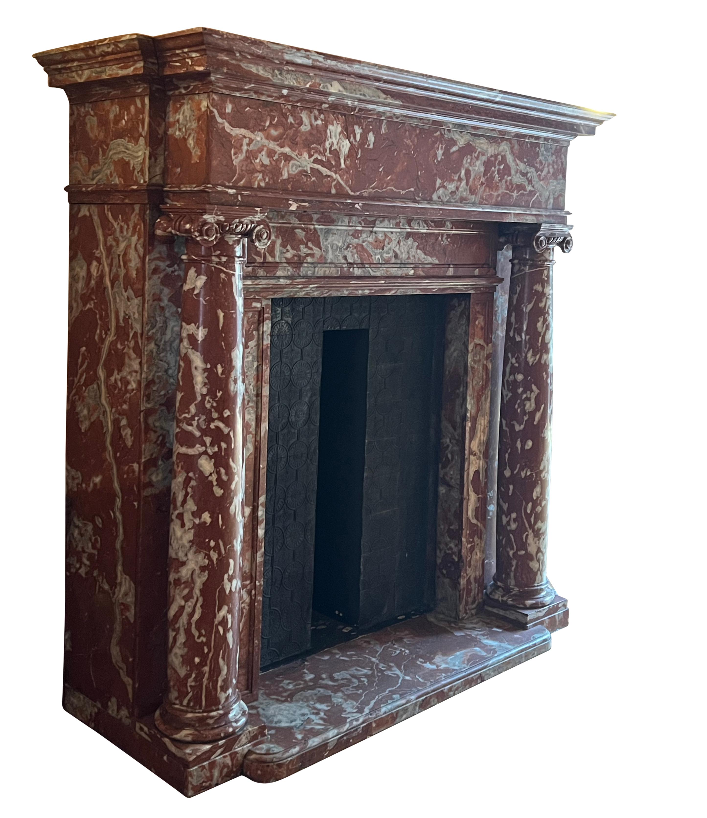 Hand-Carved Antique Red Languedoc Marble Fireplace Surround For Grand Interior Decor For Sale